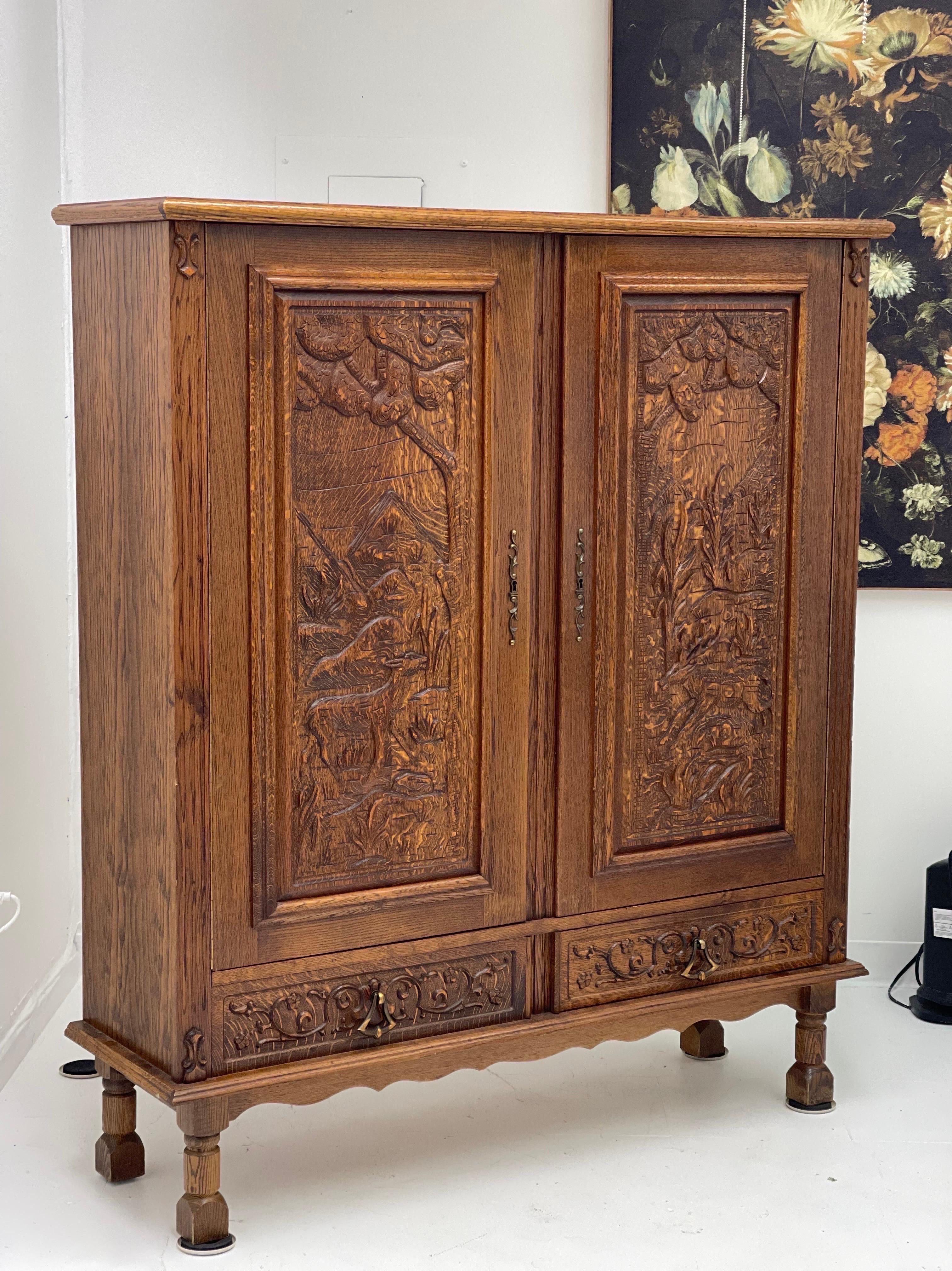 Mid-20th Century Vintage Cabinet from Germany with Hand Carved Motifs, circa 1930s For Sale