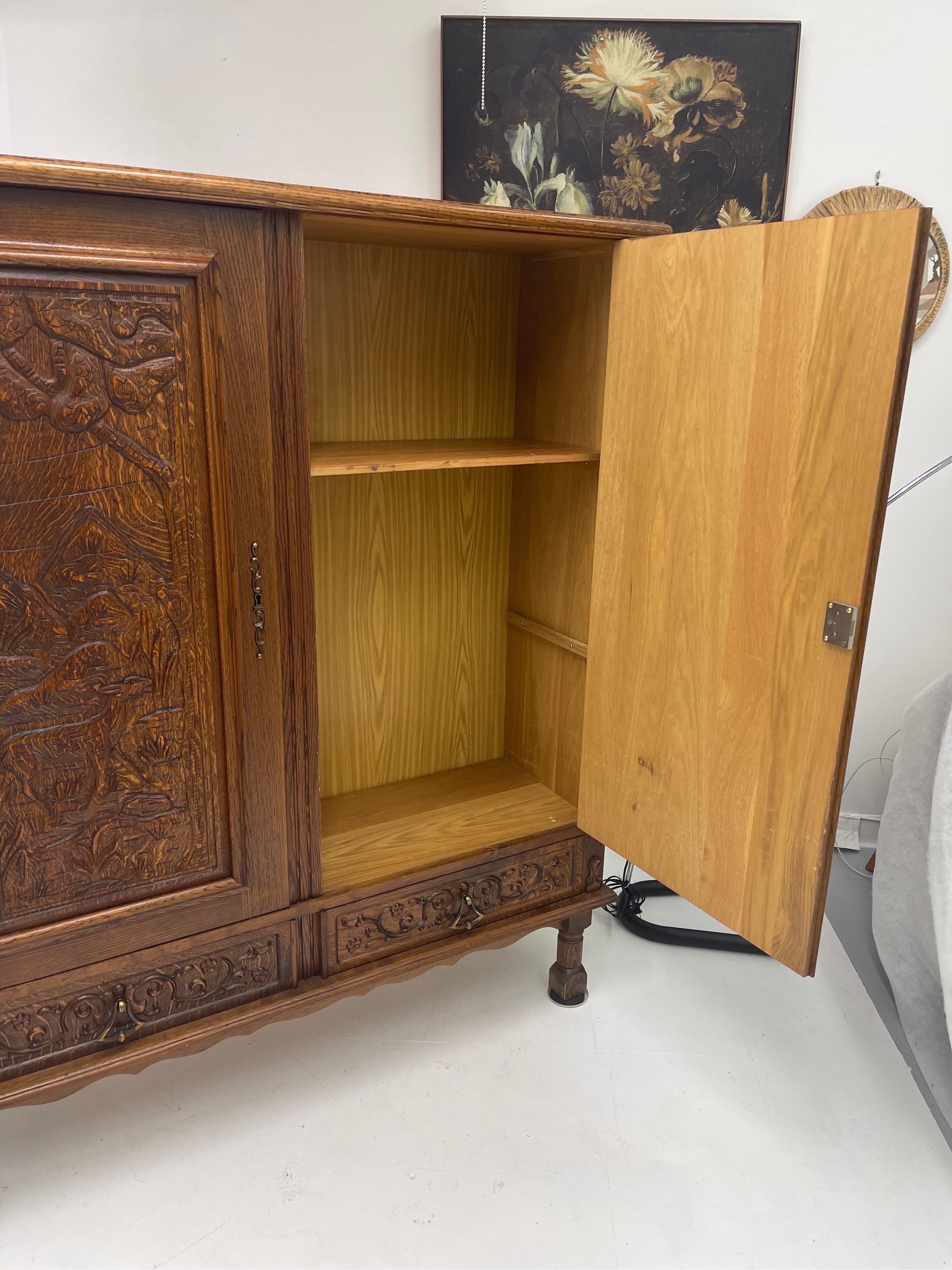 Wood Vintage Cabinet from Germany with Hand Carved Motifs, circa 1930s For Sale