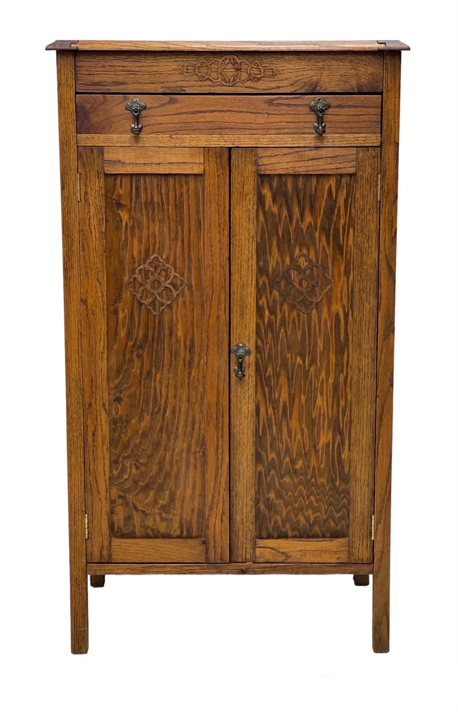 Vintage cabinet storage with adjustable shelves. Possibly Tiger oak with original hardware.

Dimensions: 27 W; 18 1/2 D; 48 H.