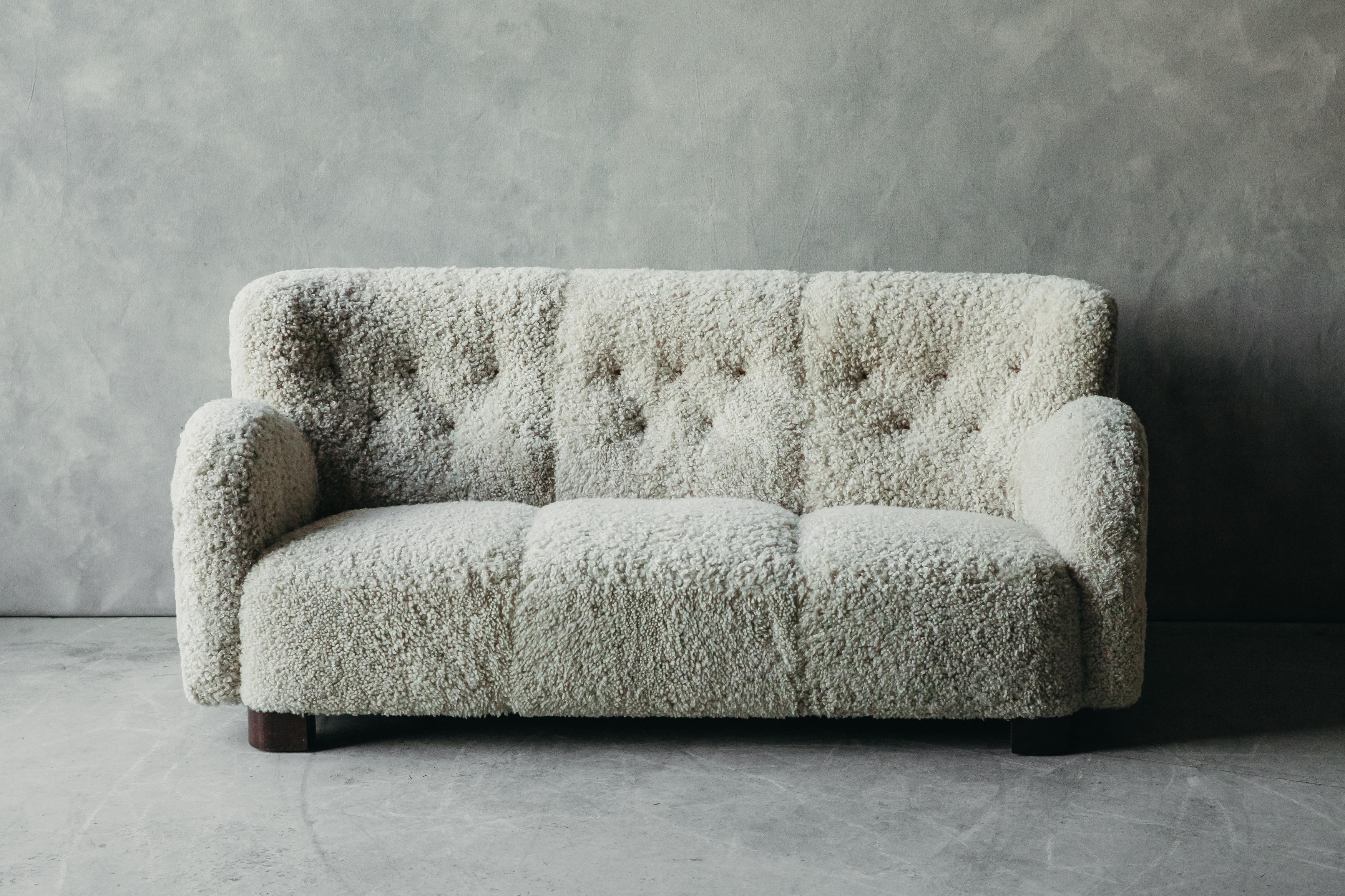 Vintage cabinetmaker sofa from Denmark, circa 1960. Later professionally upholstered in Denmark with premium shearling.

We don't have the time to write an extensive description on each of our pieces. We prefer to speak directly with our clients.