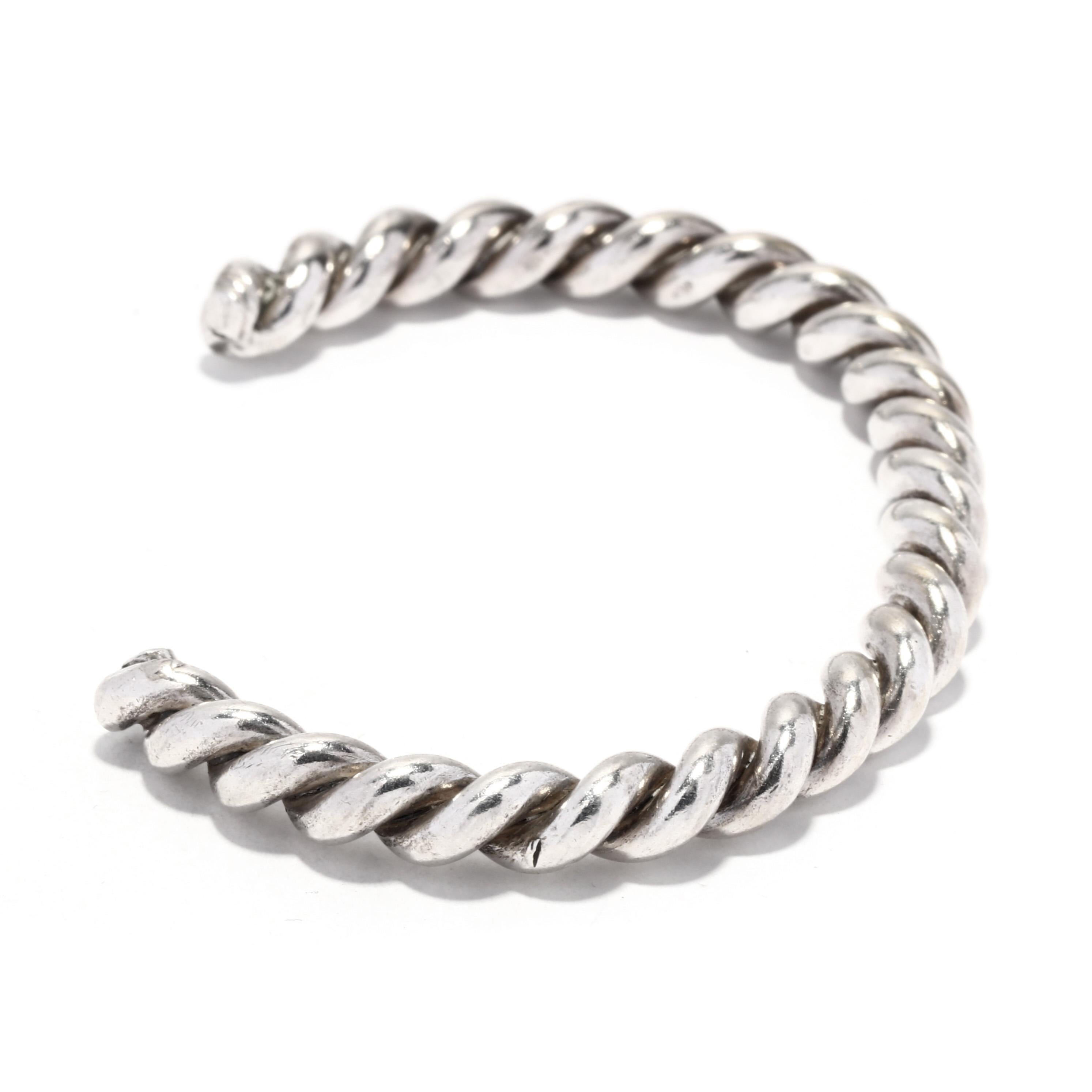 This classic sterling silver cable cuff bracelet is the perfect addition to any outfit. The slim design is made from sterling silver with a subtle twist detailing. It is 6.25 inches in length and is perfect for any occasion. This simple cuff