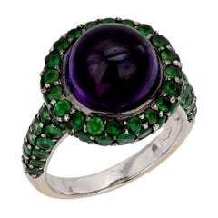 Anello cocktail vintage con ametista cabochon e tsavorite in oro bianco 18 carati
