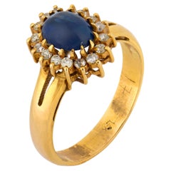 Anello a grappolo d
oro 14k con zaffiro taglio cabochon vintage e diamante