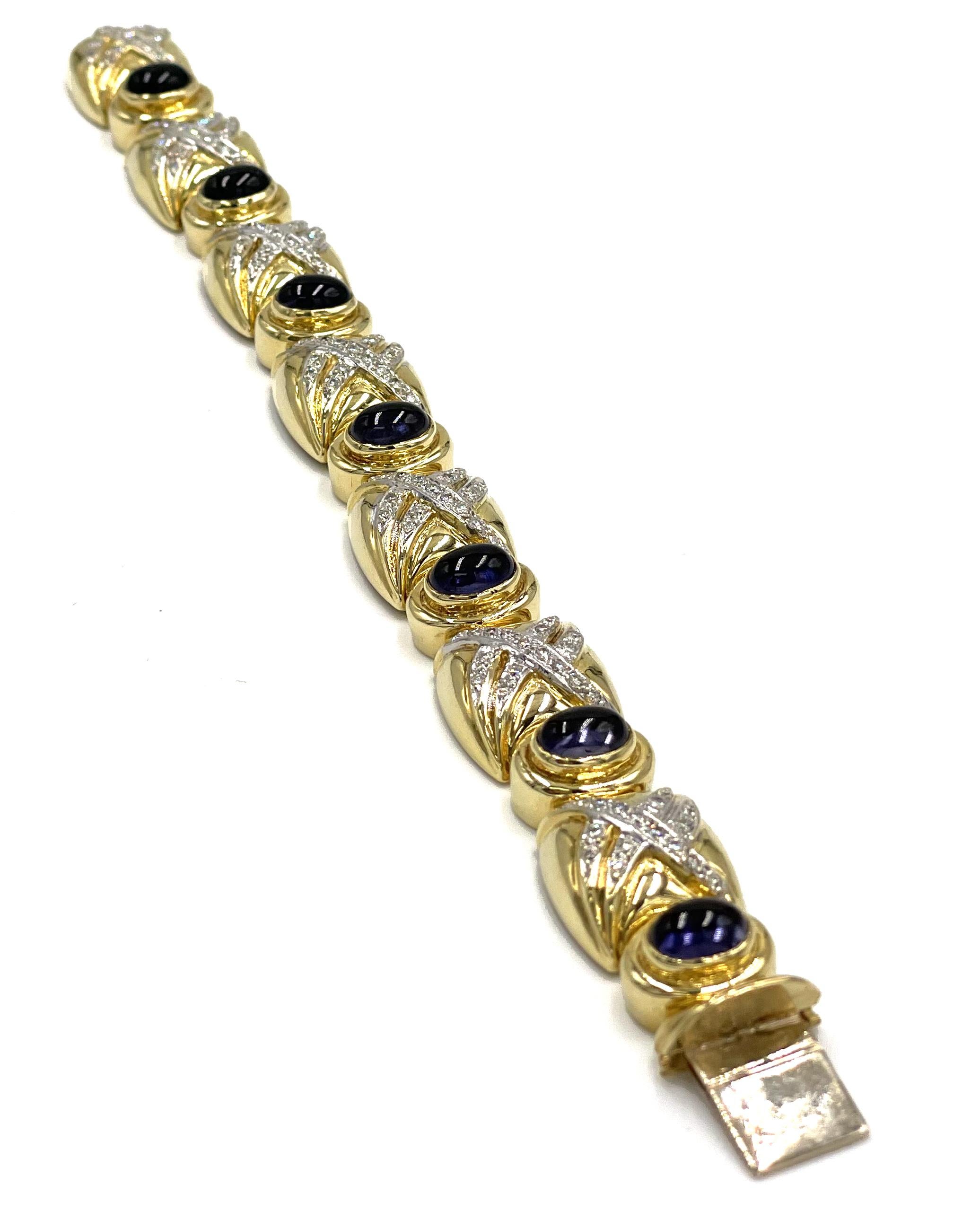 Vintage 18K yellow gold bracelet with 116 round diamonds totaling 1.50 carats (G/H color and VS clarity) and with 7 cabochon-cut iolites 5X7 millimeters each.  Bracelet length is approximately 6.75 inches long and the bracelet width is approximately