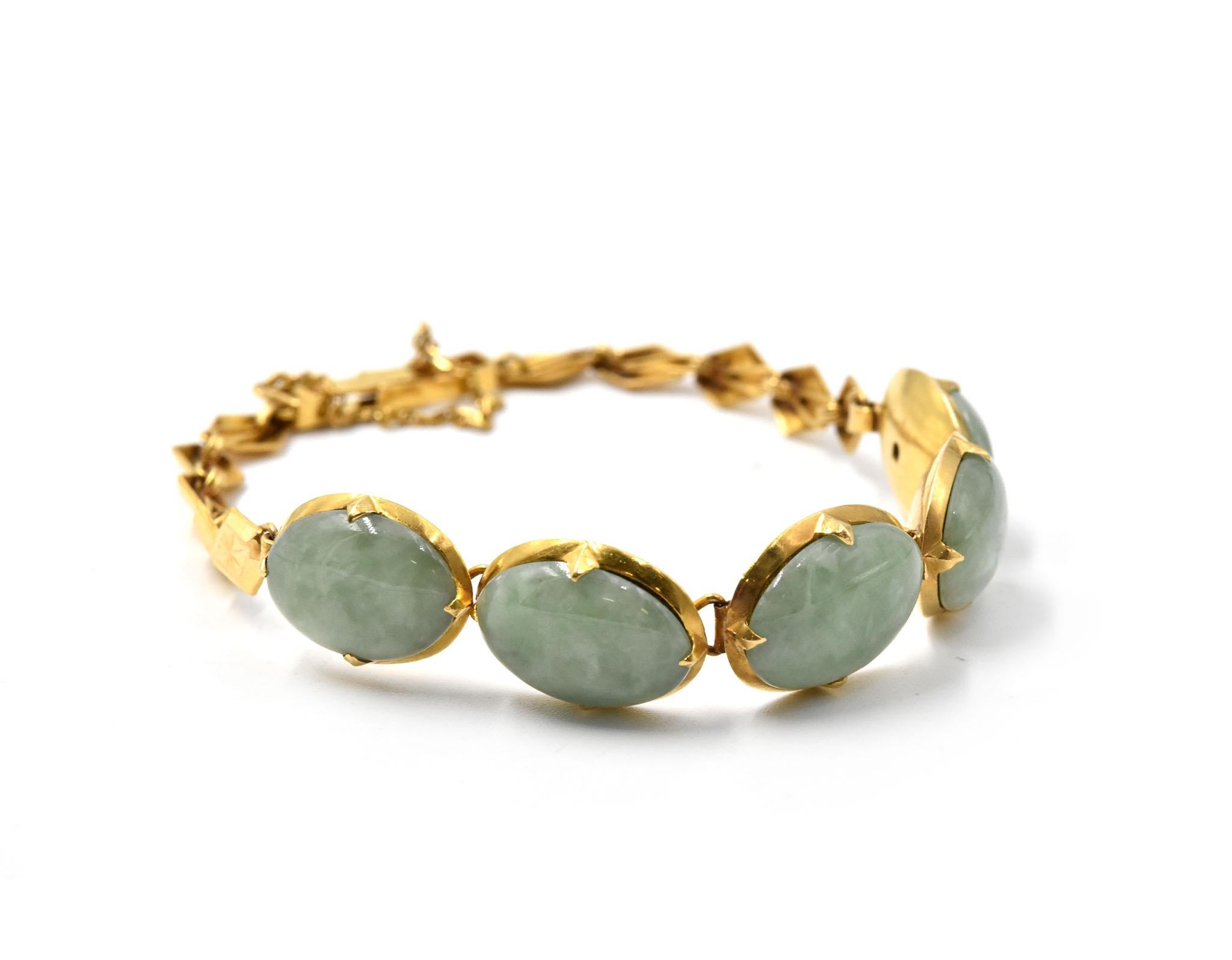 Designer: custom design
Material: 21k yellow gold with safety chain
Gemstones: cabochon oval shape jade stones
Dimensions: bracelet is 7-inch long x 3/8-inch wide
Weight: 11.00 grams
