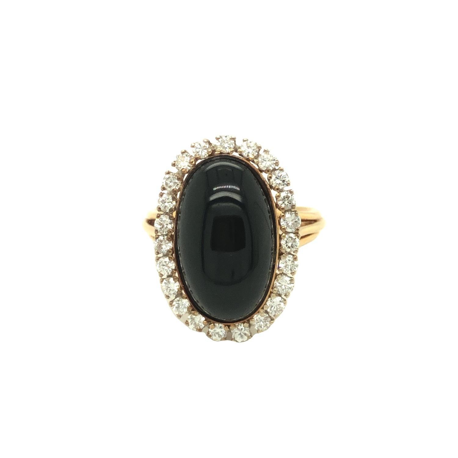Onyx is thought to be a protector for harmonious relationships. This elegant onyx and diamond ring is a beautiful alternative for an engagement ring. The oval shaped cabochon onyx is encircled by near colorless round brilliant cut diamonds weighing