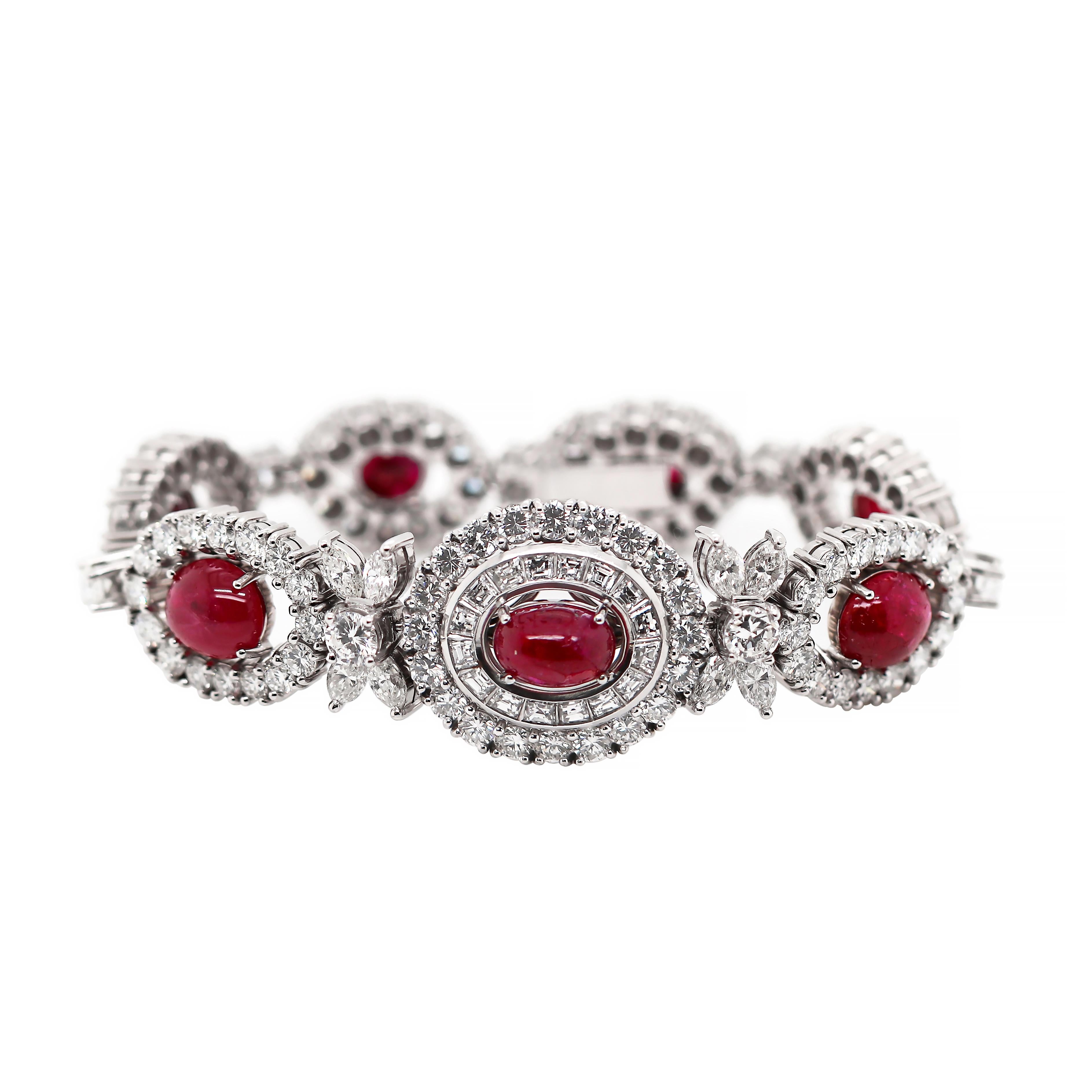 Exceptional vintage bracelet featuring  seven oval cabochon cherry red rubies weighing approximately 20.00 carat total, each beautiful claw set in the center of a diamond halo. The centre section of the bracelet is mounted with a double halo, one