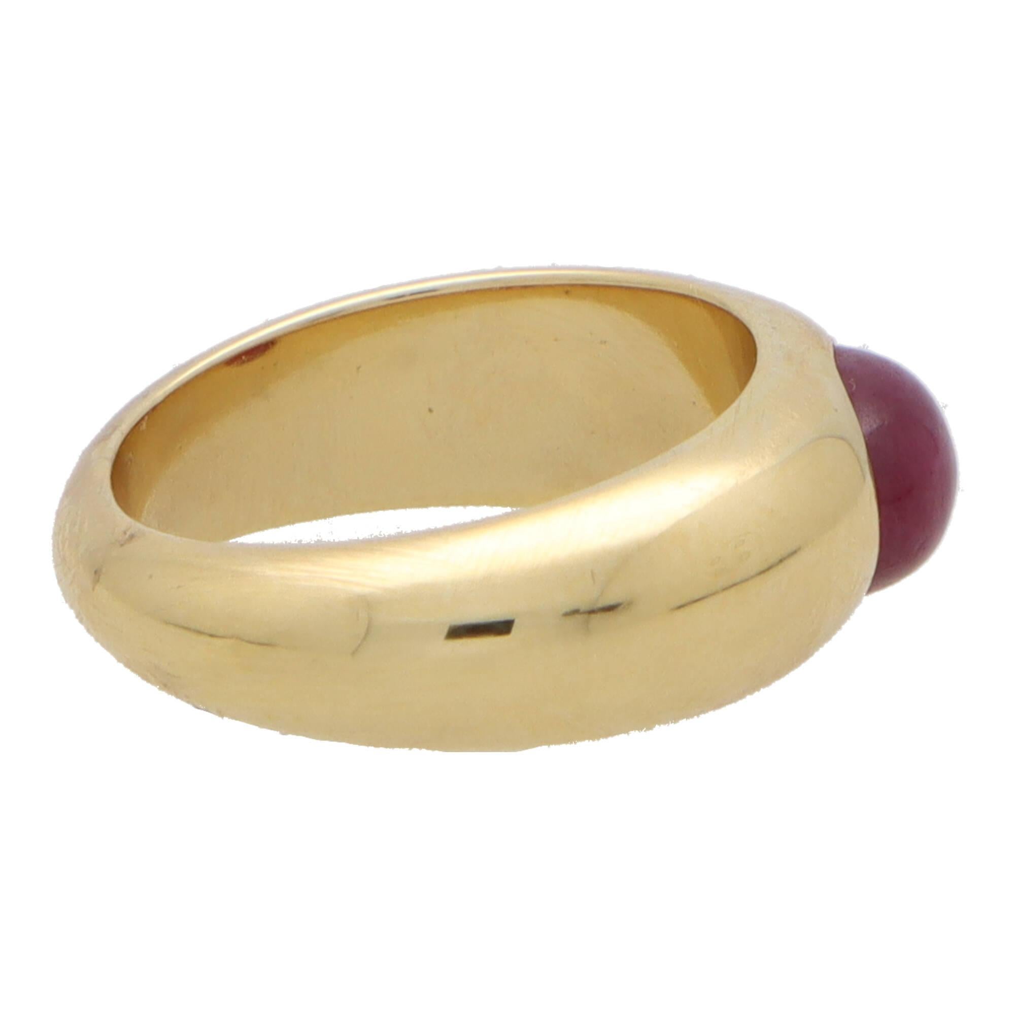 A stylish vintage cabochon ruby gypsy set chunky ring set in 18k yellow gold.

The ring is solely set with an oval cabochon vibrant red ruby stone that is bezel set securely in a chunky style band.

Due to the design and size, this ring could be