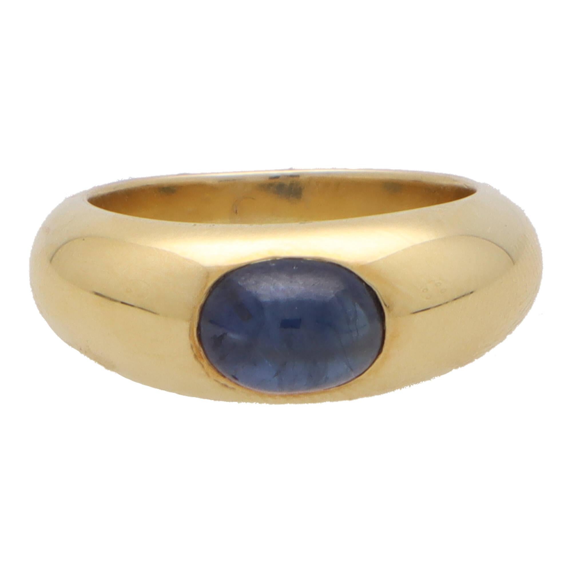 A stylish vintage cabochon sapphire gypsy set chunky ring set in 18k yellow gold.

The ring is solely set with an oval cabochon blue sapphire stone that is bezel set securely in a chunky style band.

Due to the design and size, this ring could be