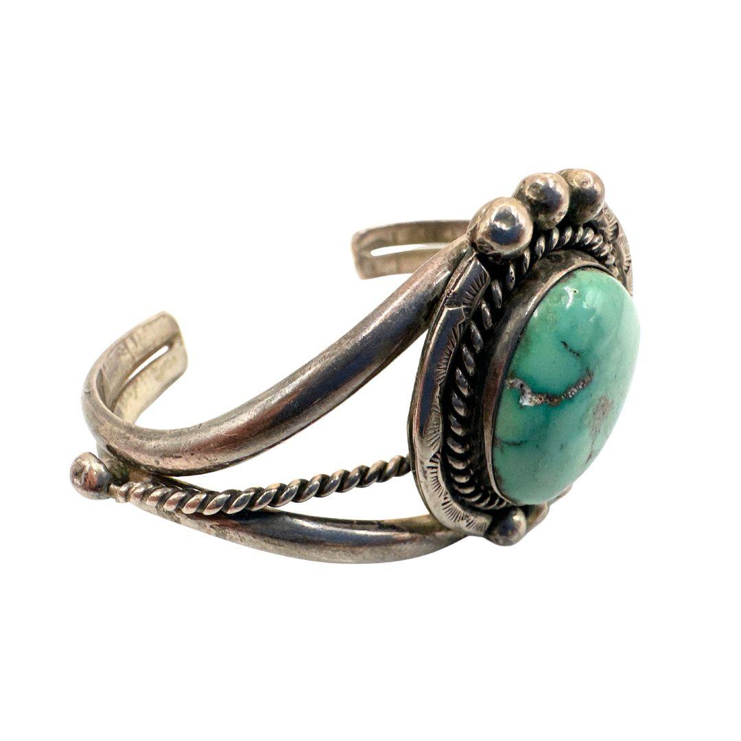 Turquoise stone diameter: 0.85″

Bracelet Inside diameter: 2.30″

Bin Code: A4 / P20

Step into the world of vintage elegance with this exquisite turquoise silver antique cuff bracelet. Crafted with meticulous attention to detail and imbued with a