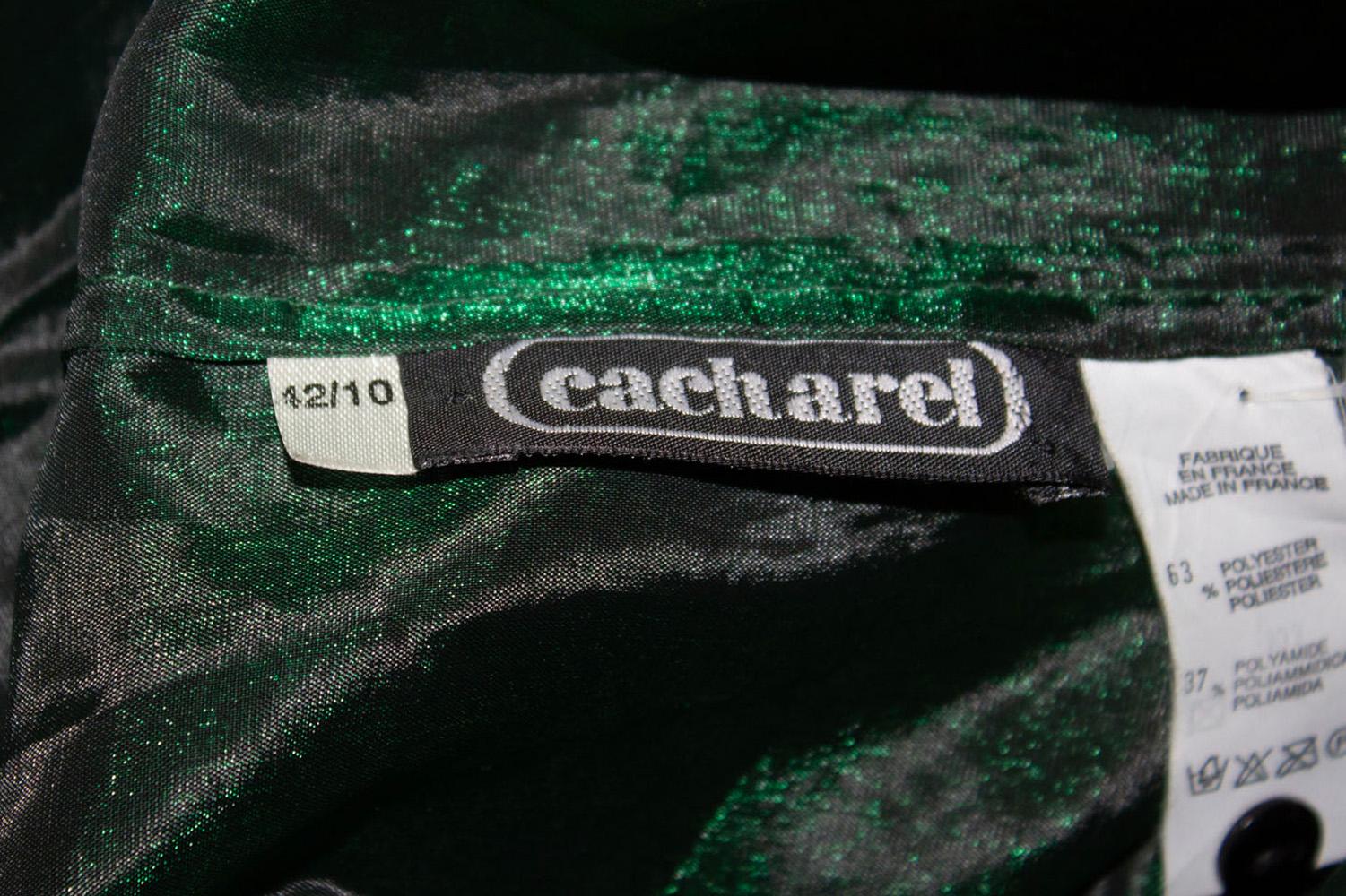 A fabulous shirt for the forthcoming party season by Cacharel. The is in a wonderful Christmas tree green colour and has a front button opening and cut away collar. 
Measurements: Bust 36'', length 22''.
