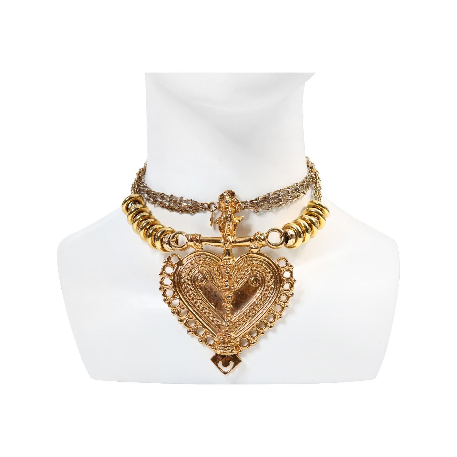 Vintage Cadoro Gold Tone Heart Necklace Circa 1980s.  Very chic. This is an unusual necklace and so well made.  It can be worn long or doubled.  On either side are large and small rings that ae movable.  The photographer moved them up in some of the