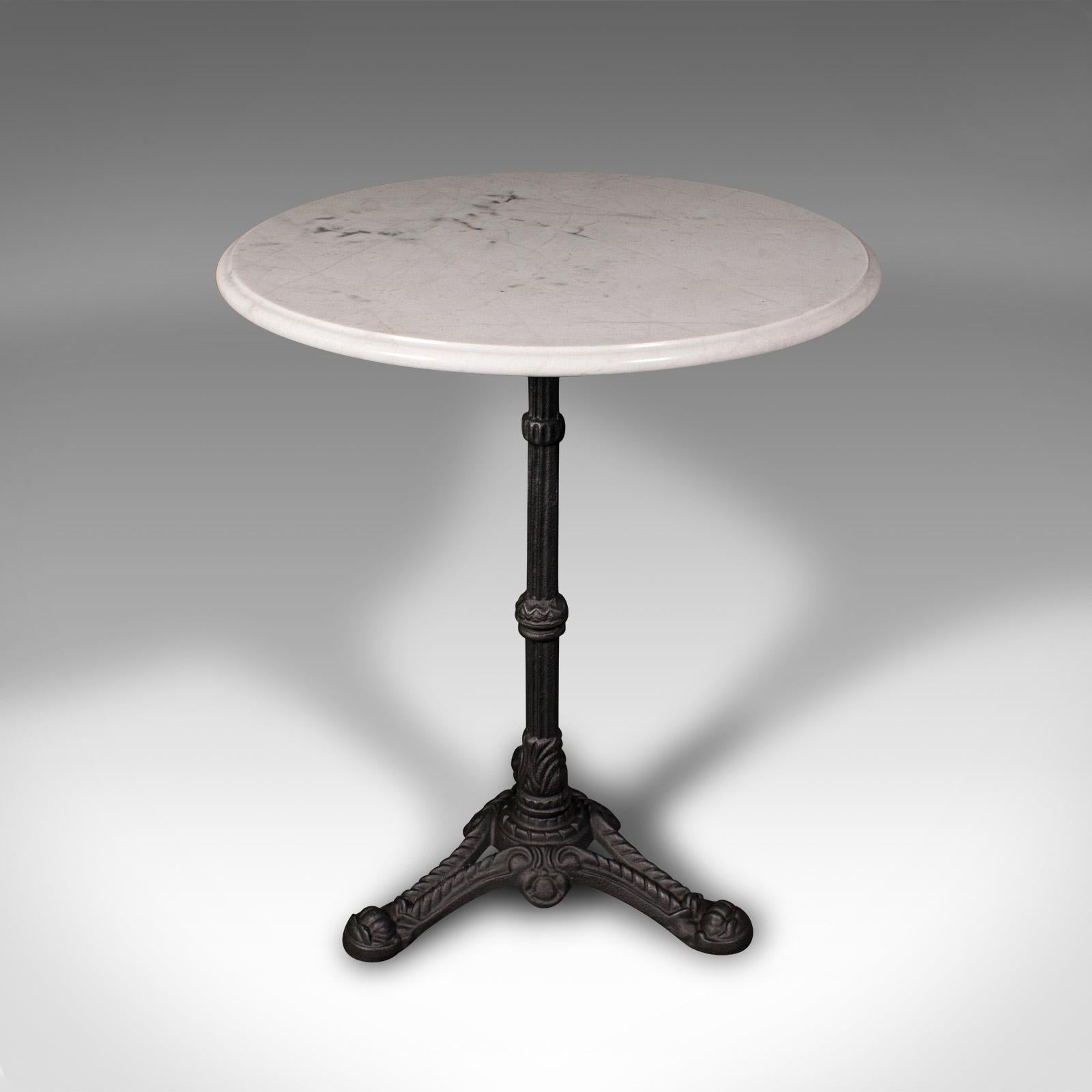This is a vintage cafe table. A French, marble and cast iron wine or garden table, dating to the mid 20th century, circa 1950.

Pleasingly chic table with a delightful marble top
Displays a desirable aged patina and in good order
Tactile white