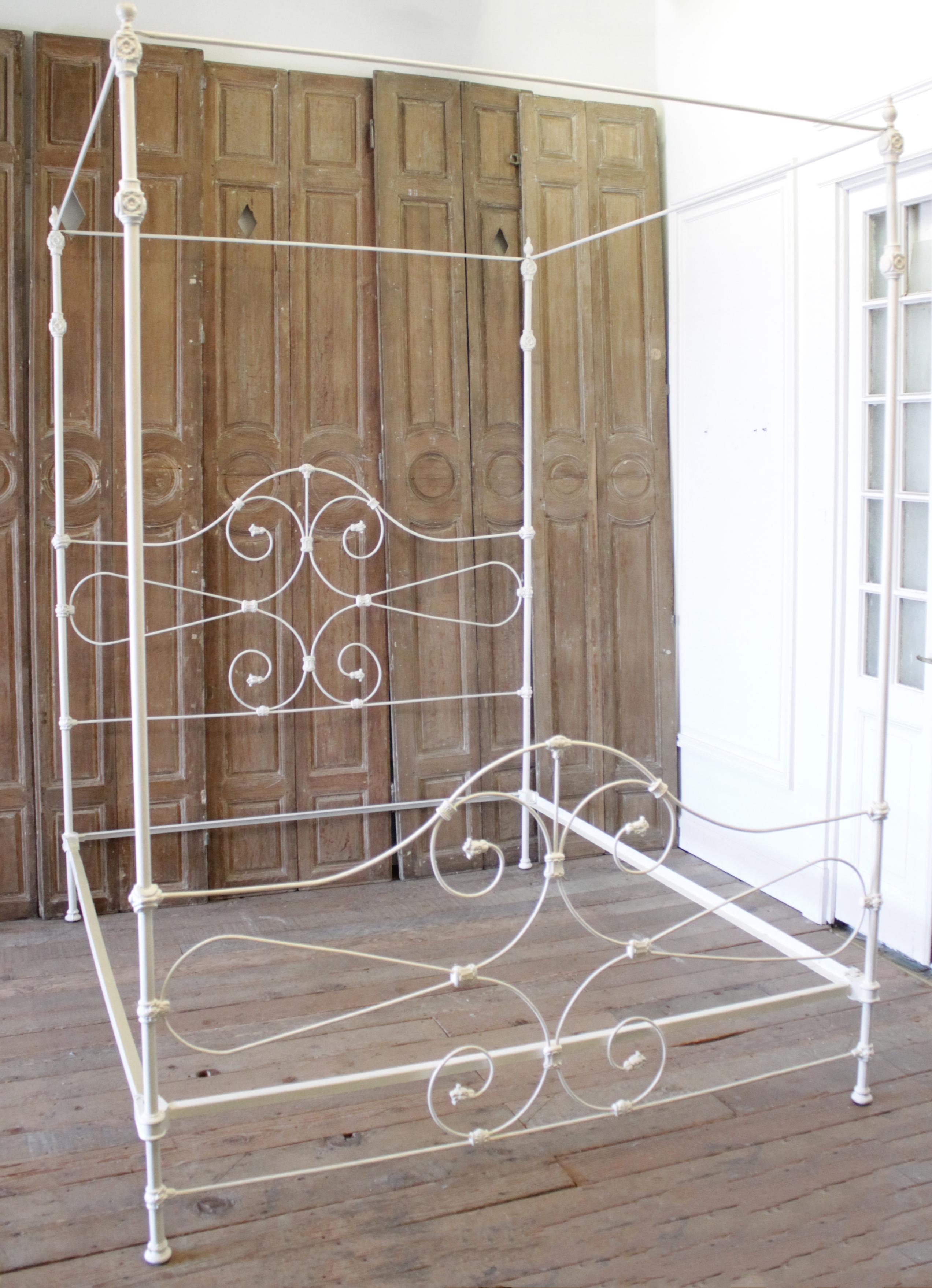 Vintage Cal King iron canopy bed
Painted in a soft white color.
The canopy can be extended to two different heights as shown in photos with extensions, and without.
Measures 72
