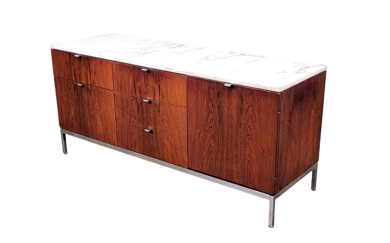 A vintage and timeless rosewood credenza with original white Calacatta marble top on chrome legs with chromed pulls and finished back. A very versatile piece, perfect for any home or office as it can also be used as a dresser, a media console or a