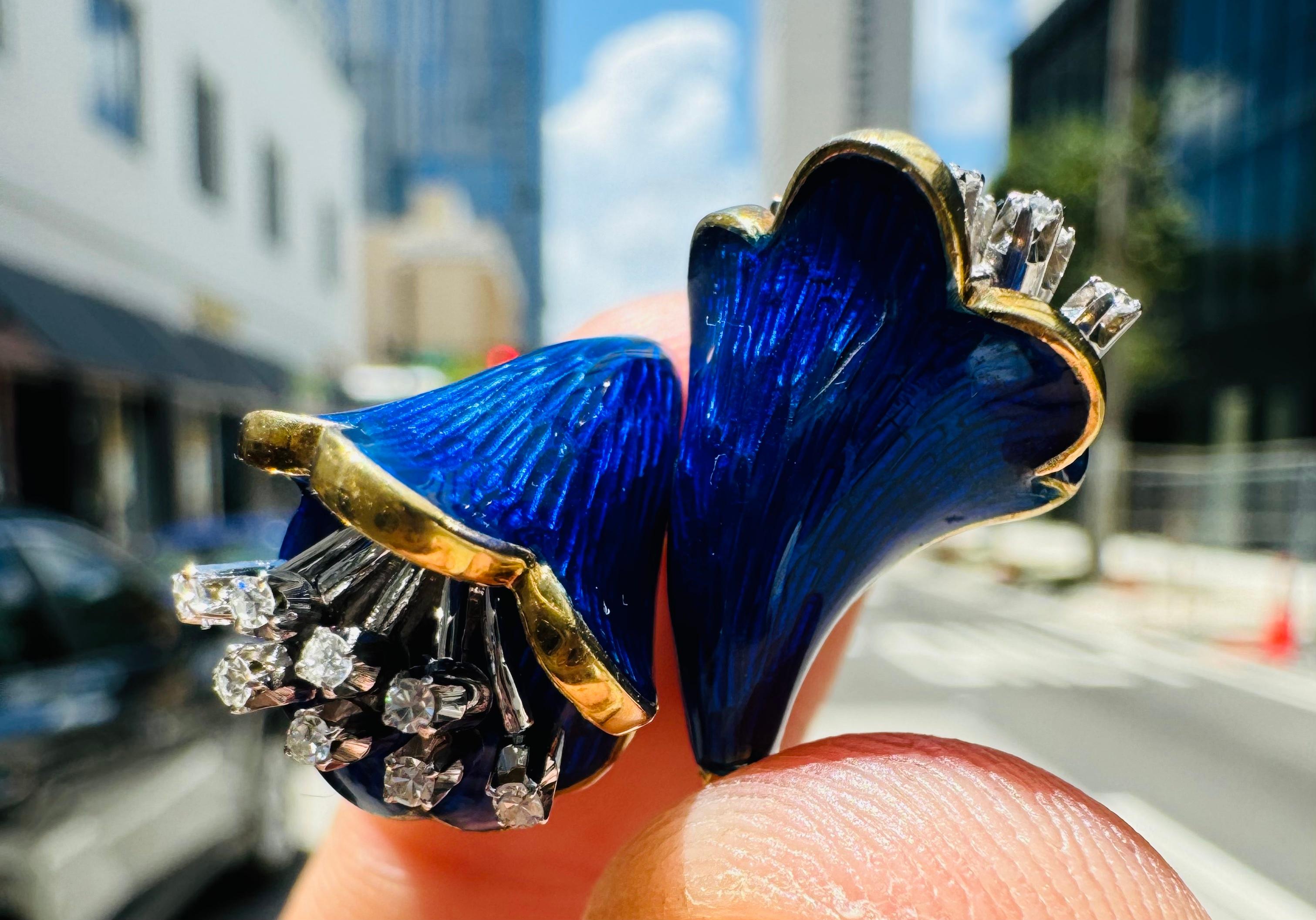 Exquisite ring crafted in the form of a Calla Lillie flower in full bloom coated in an electric colored cobalt blue enamel. The  design is breathtaking as the guilloche blue color sparkles in the sunlight when worn. 
The ring depicts two individual