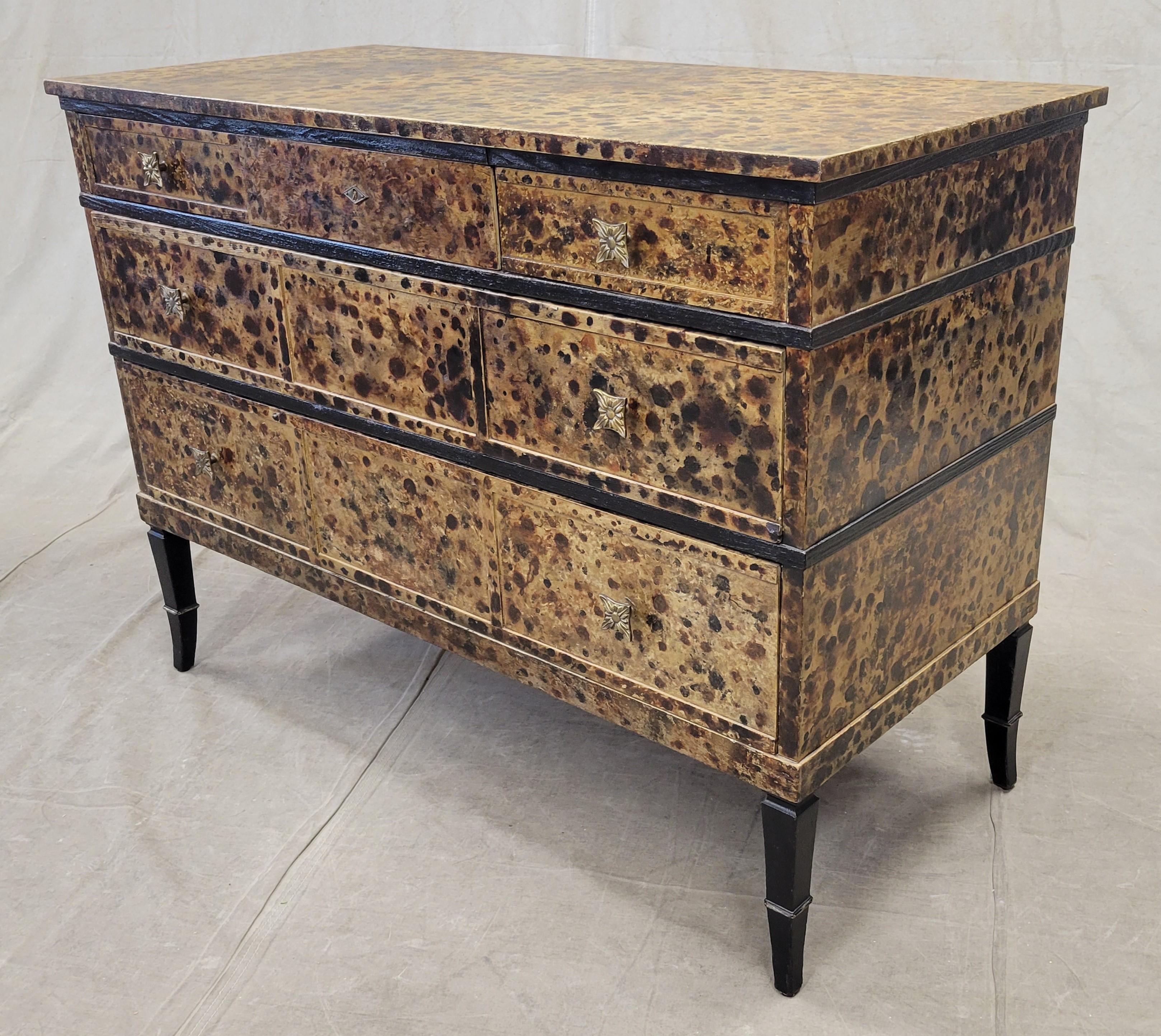 A unique and elegant vintage faux tortoise painted dresser chest of drawers. 