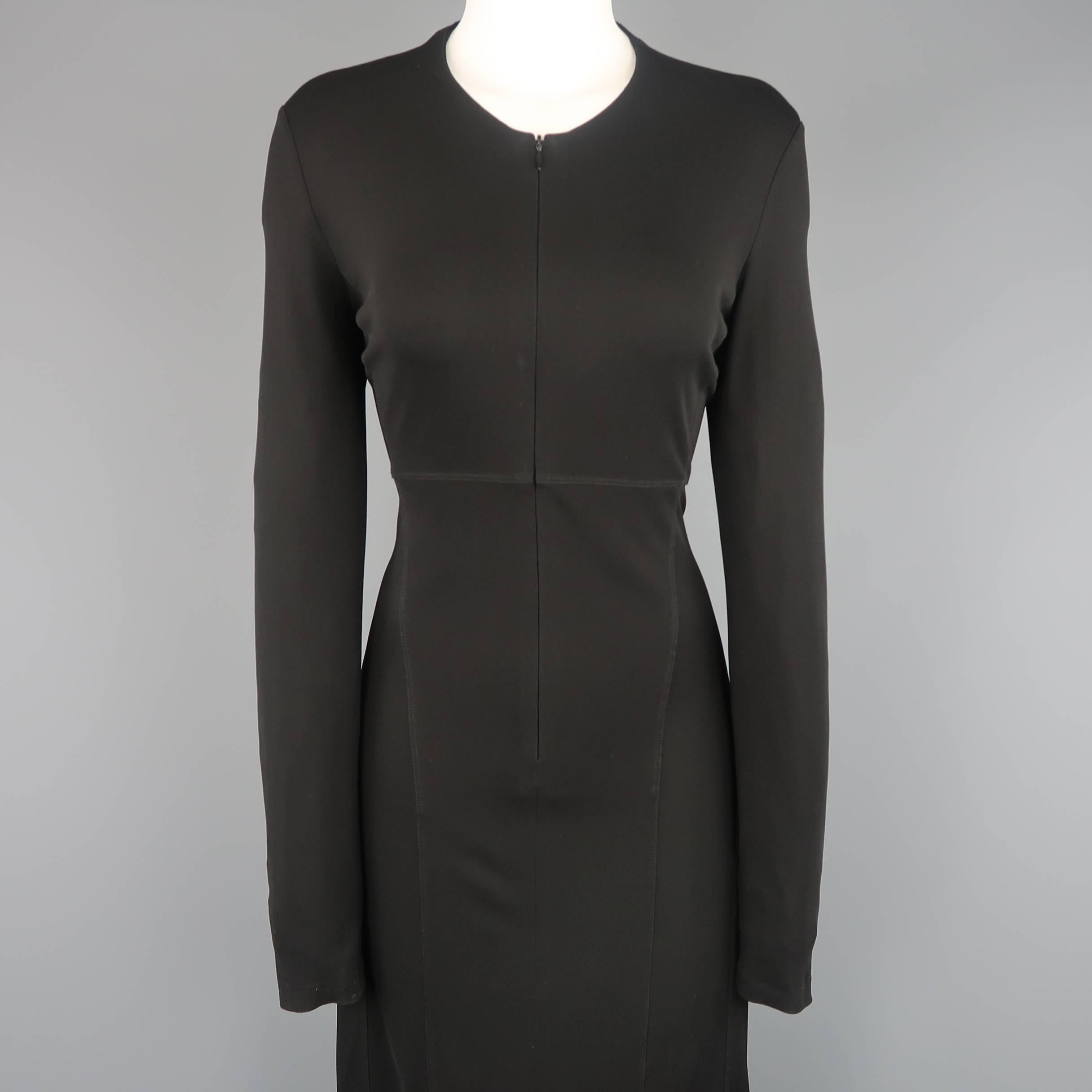 Vintage CALVIN KLEIN maxi dress comes in black viscose and features a round neckline, hidden zip up front, long sleeves, and decorative contour seams. Made in Italy.
 
Good Pre-Owned Condition.
Marked: 8
 
Measurements:
 
Shoulder: 16 in.
Bust: 36