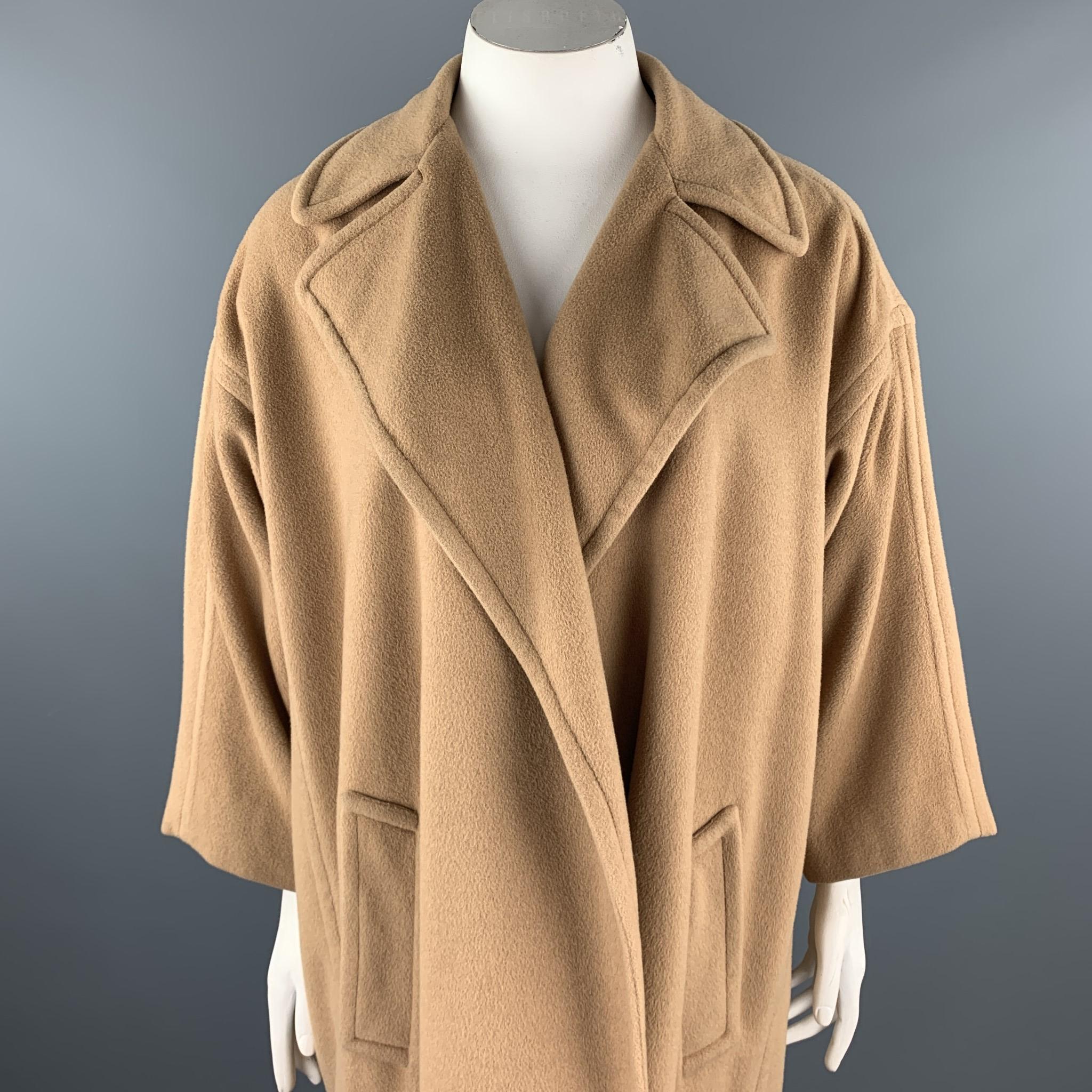 Vintage CALVIN KLEIN coat comes in a camel fabric with a full liner featuring a notch lapel style and a open font closure. Made in USA.

Good Pre-Owned Condition.
Marked: 8

Measurements:

Shoulder: 22 in. 
Chest: 48 in. 
Sleeve: 16.5 in. 
Length: