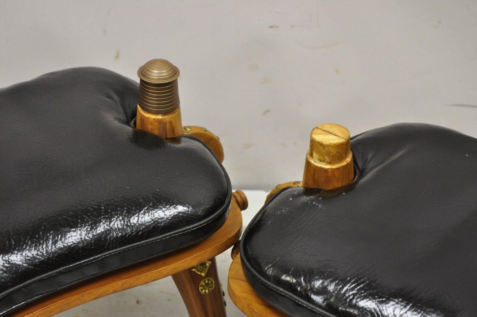 Vintage Camel Saddle Stools Carved Wood Black/Red Cushions, a Pair In Good Condition For Sale In Philadelphia, PA