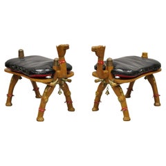 Vintage Camel Saddle Stools Carved Wood Black/Red Cushions, a Pair