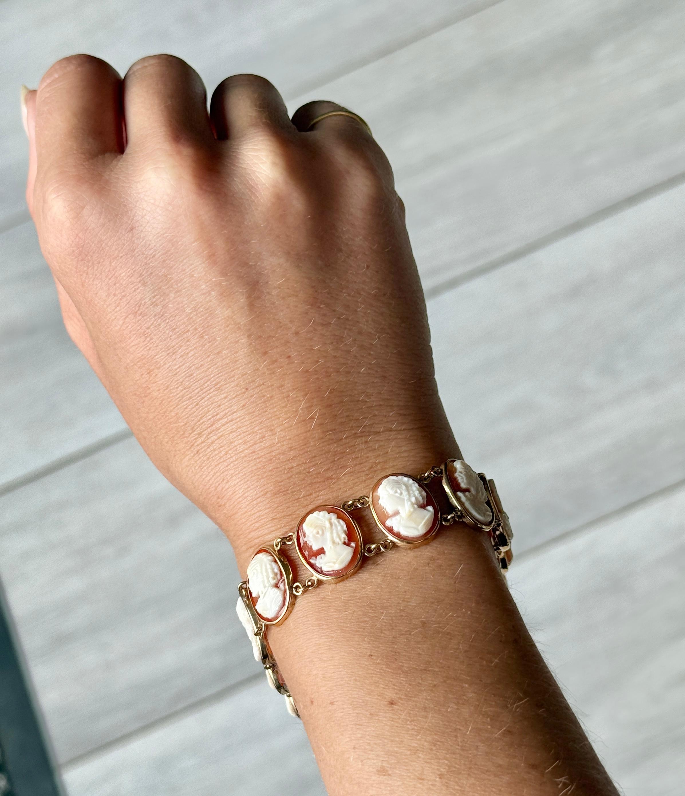 Each panel link on this cameo bracelet has a different face. Each section is linked by two delicate chains and all metal work is modelled in 9ct gold. Hallmarked Birmingham 1991. 

Length: 9.5cm 
Width: 12cm

Weight: 13.6g