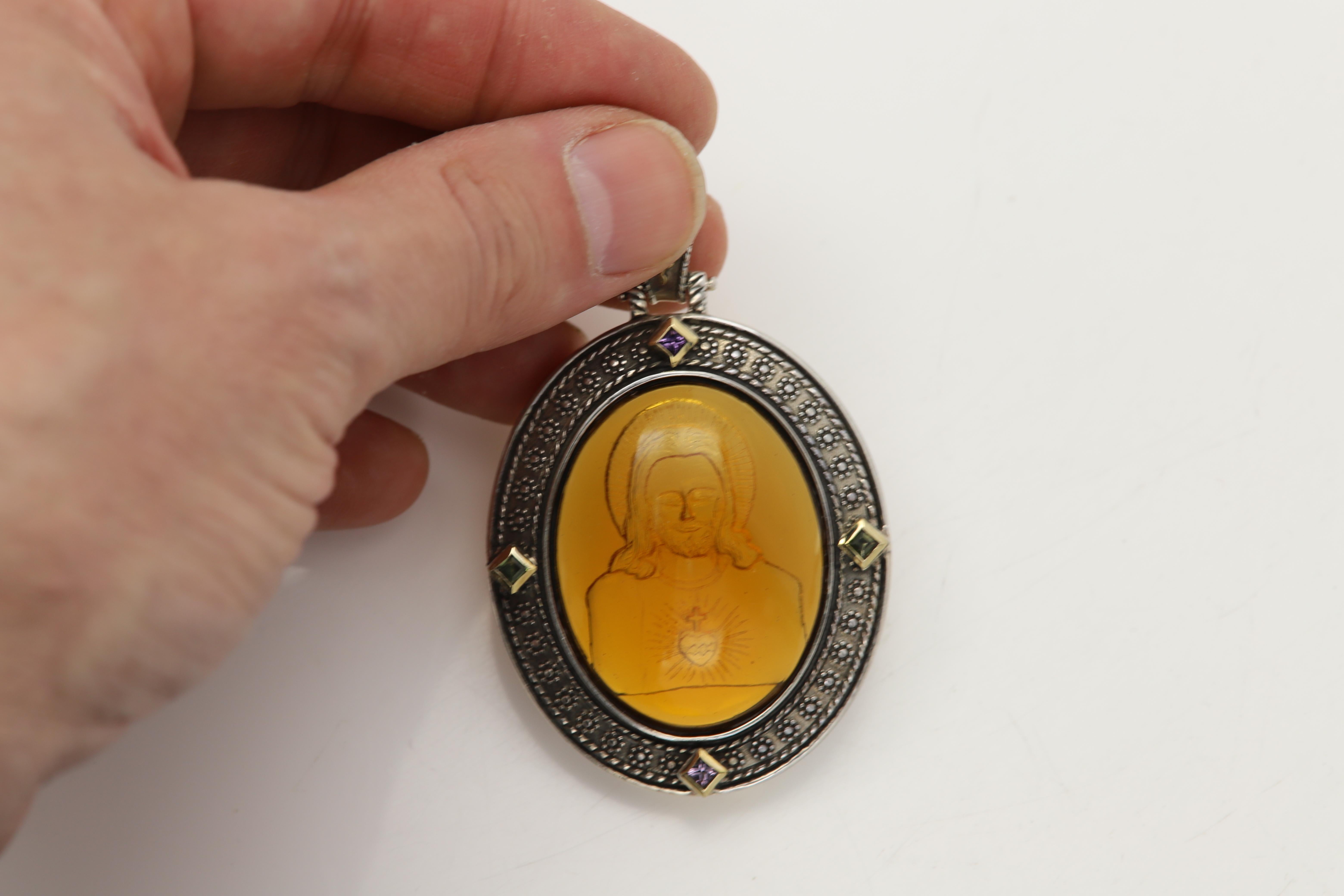 Vintage
Venetian Yellow Murano Glass Antique / Gothic Style Pendant
Image of Jesus
Sterling Silver 925, 38.0 Grams, 
with small natural Amethyst & Peridot stones,
set with real 18K Yellow Gold Ornaments, 
Pendant Size: 50 mm X 43 mm  (2' Inch