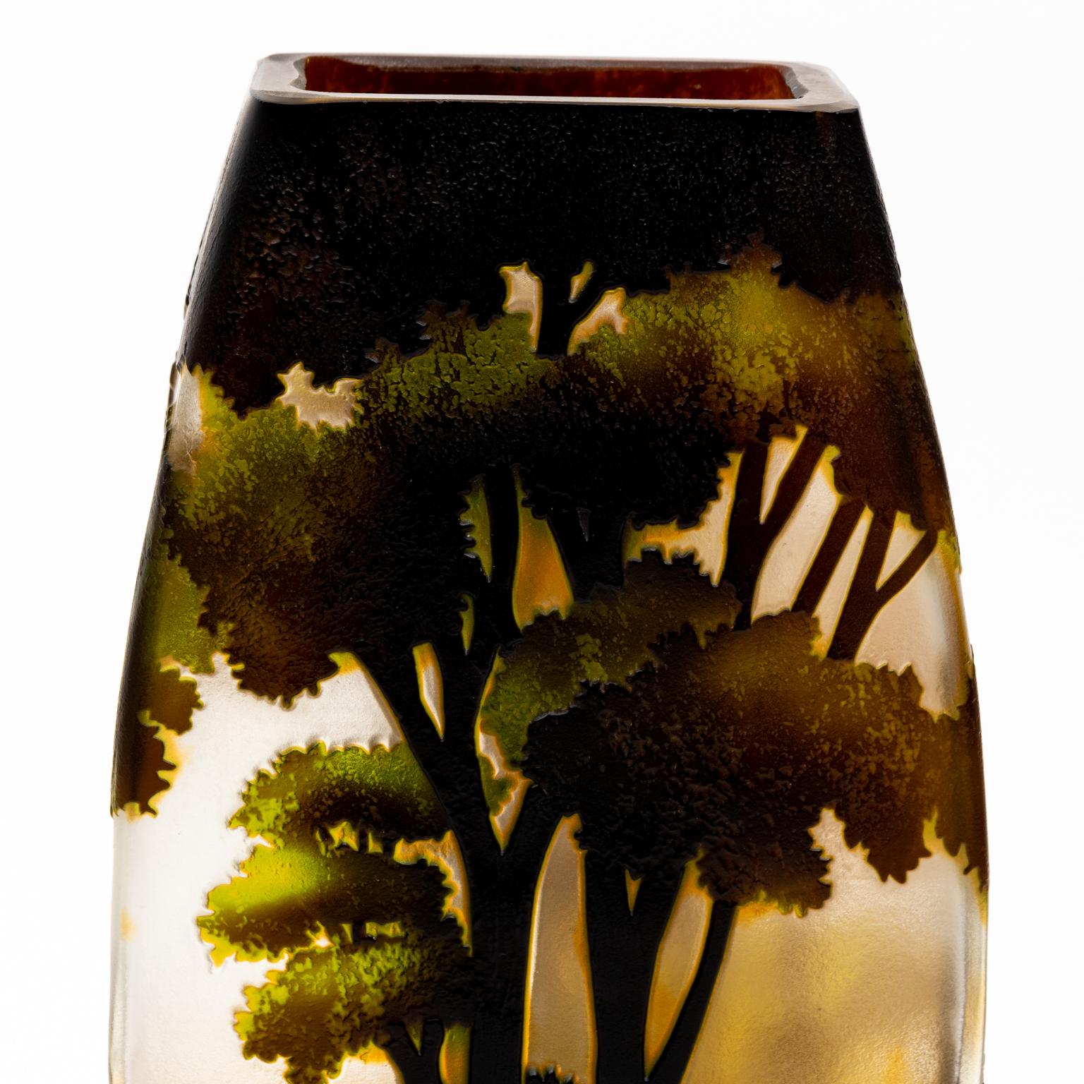 10 Inch vintage cameo glass vase in shades of green and grey with a forest scene that features lush tall trees. This four sided vase has fantastic color and looks better when lit. Please note of wear consistent with age, this vase is unmarked and