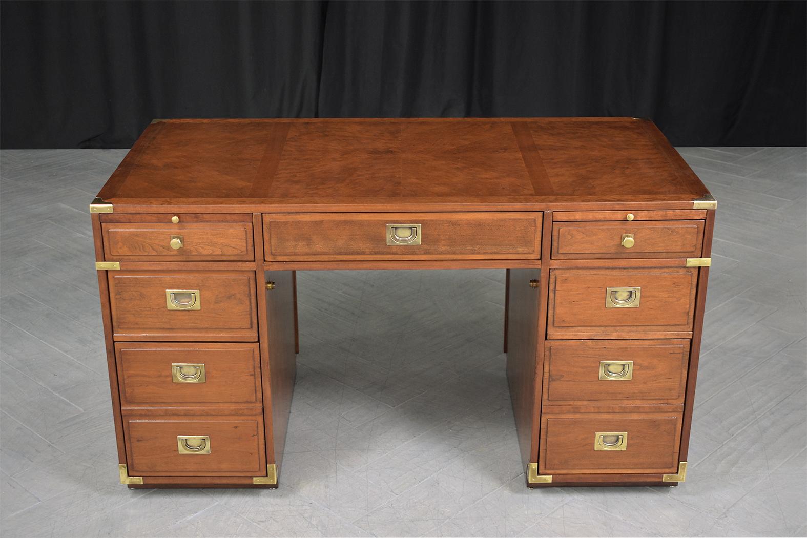 An extraordinary campaign desk executed out of maple and is in great condition has been stripped and refinished by our professional in-house expert craftsman and is completely restored. This mid-century modern executive desk is eye-catching and