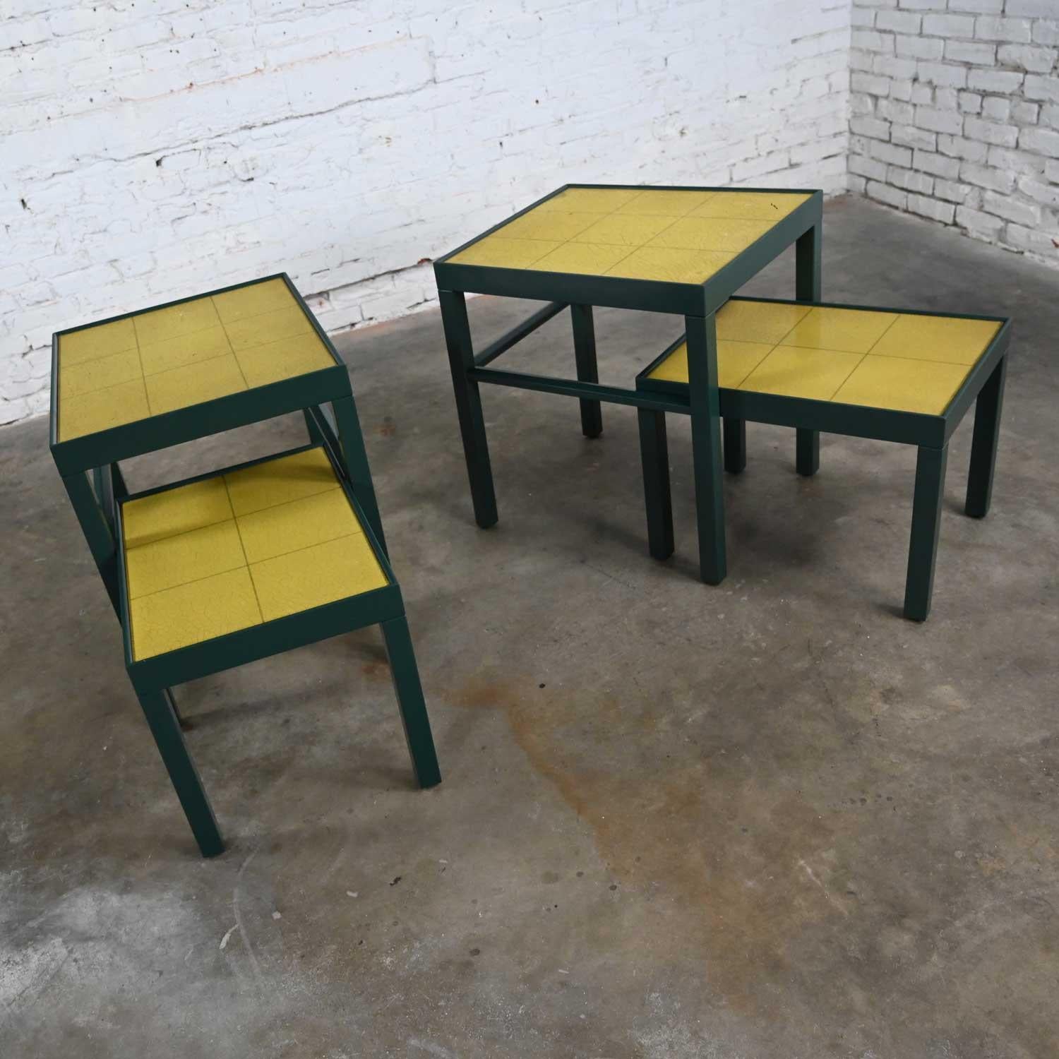Gorgeous vintage Campaign or Chinoiserie dark green painted modified Parson�’s nesting tables with chartreuse leather tops two sets of 2 tables by Kittinger Furniture. Beautiful condition, keeping in mind that these are vintage and not new so will