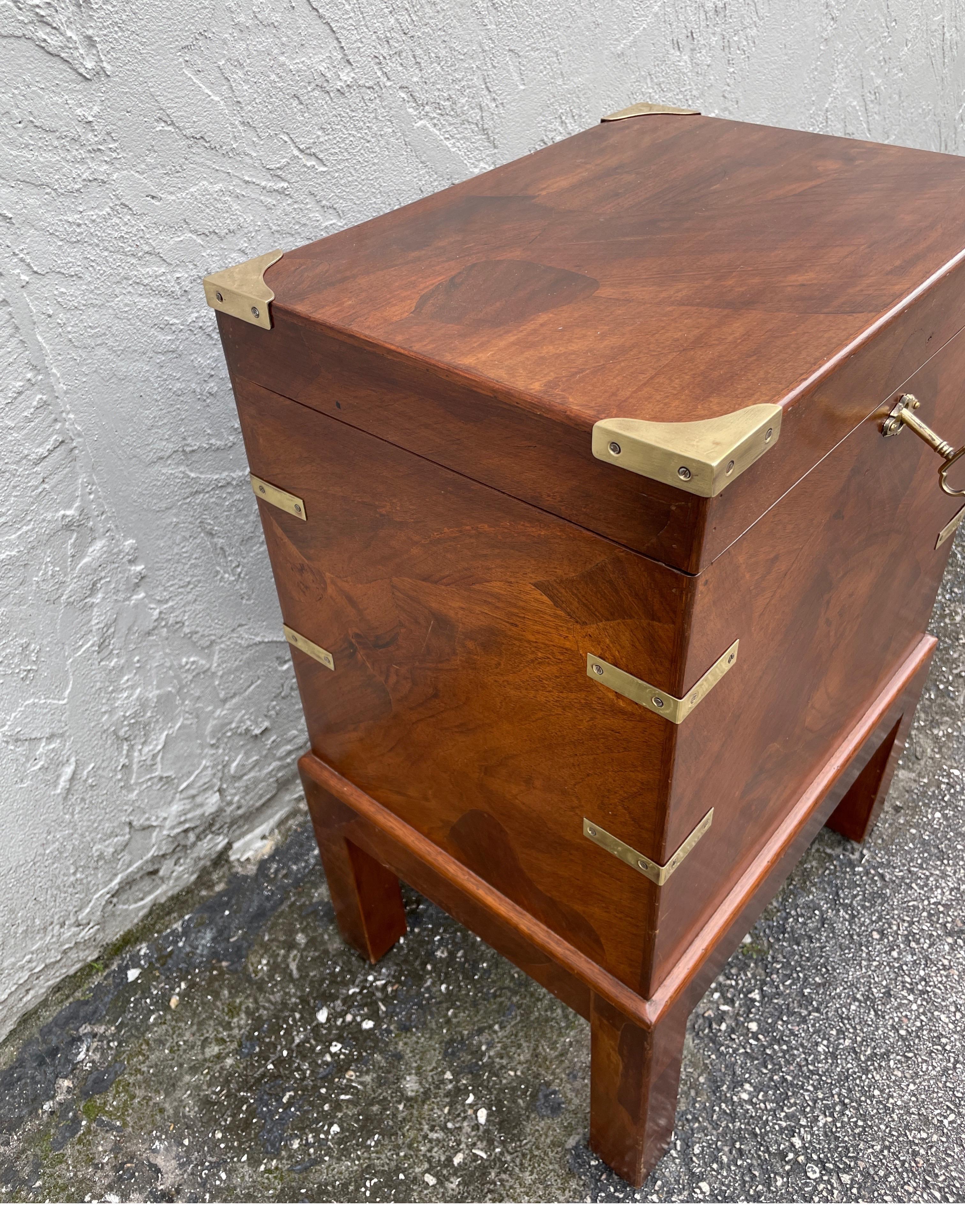 Vintage Campaign Style Box on stand with brass hardware.  Opens for storage & is a wonderful side table.
