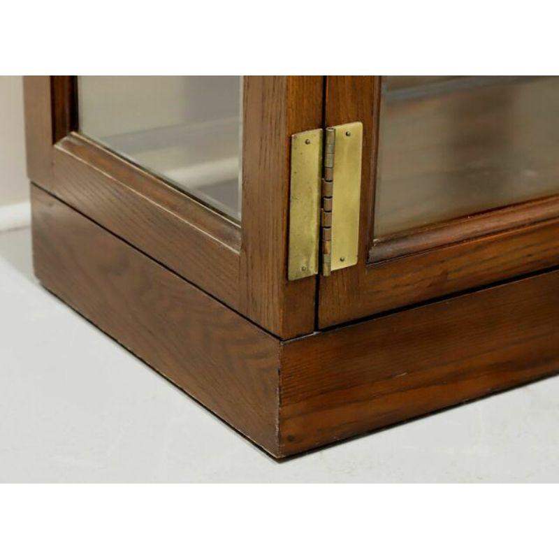 Oak Campaign Style Curio Cabinet by JASPER CABINET COMPANY - B