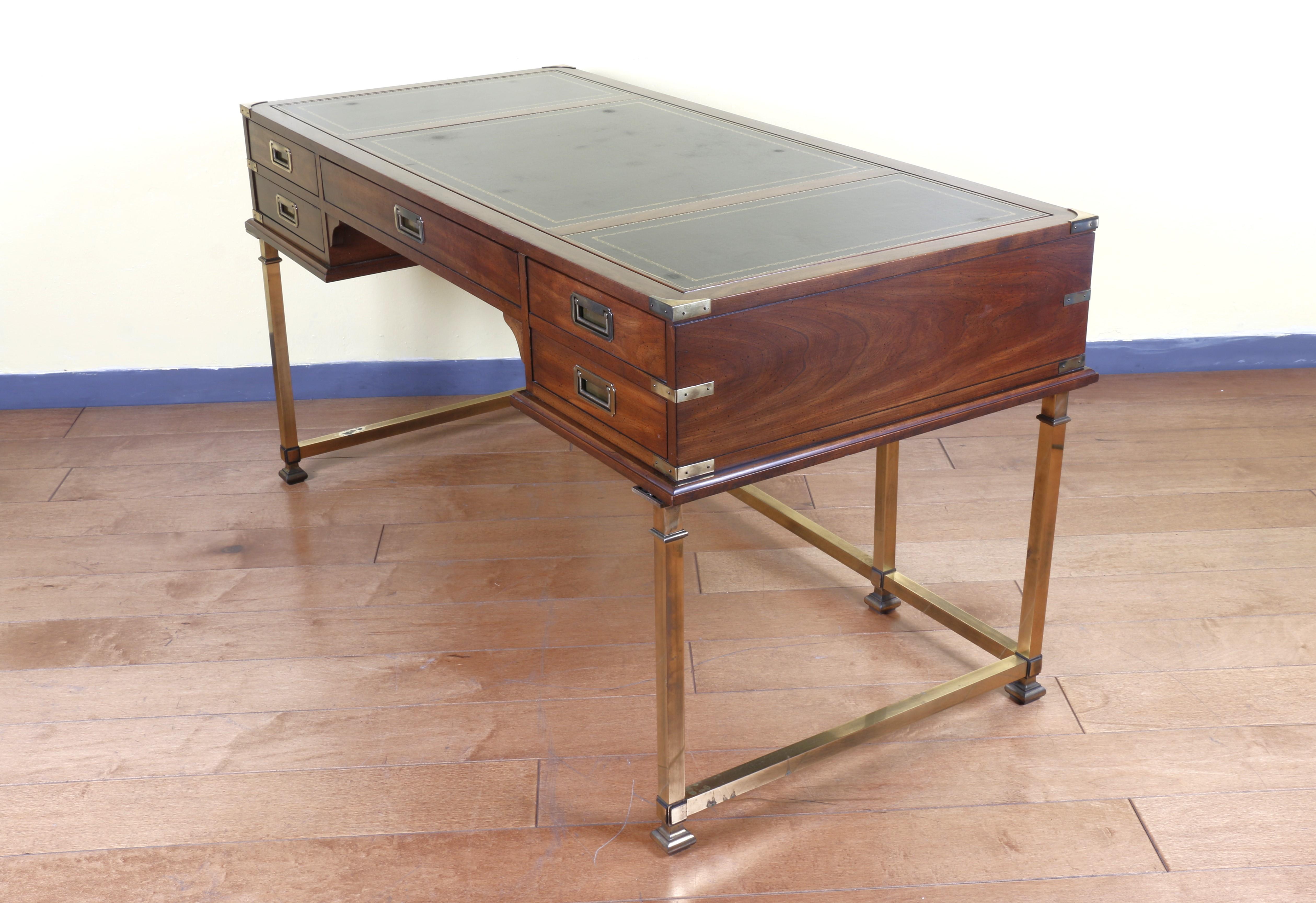 Wonderful Vintage Campaign Style Writing Desk manufactured by Sligh. Five drawers with brass handles, leather top, and its legs are brass. Original conditions. No broken parts. Will look gorgeous anywhere