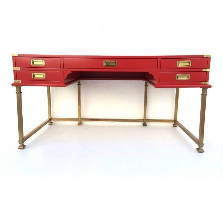 Classic Campaign style desk manufactured by Sligh of Holland/Grand Rapids, Michigan. Restored, consist of five drawers with recessed brass pulls. Inlaid leather top with elegant embossed gold design and brass legs. Brass bound corners and Campaign