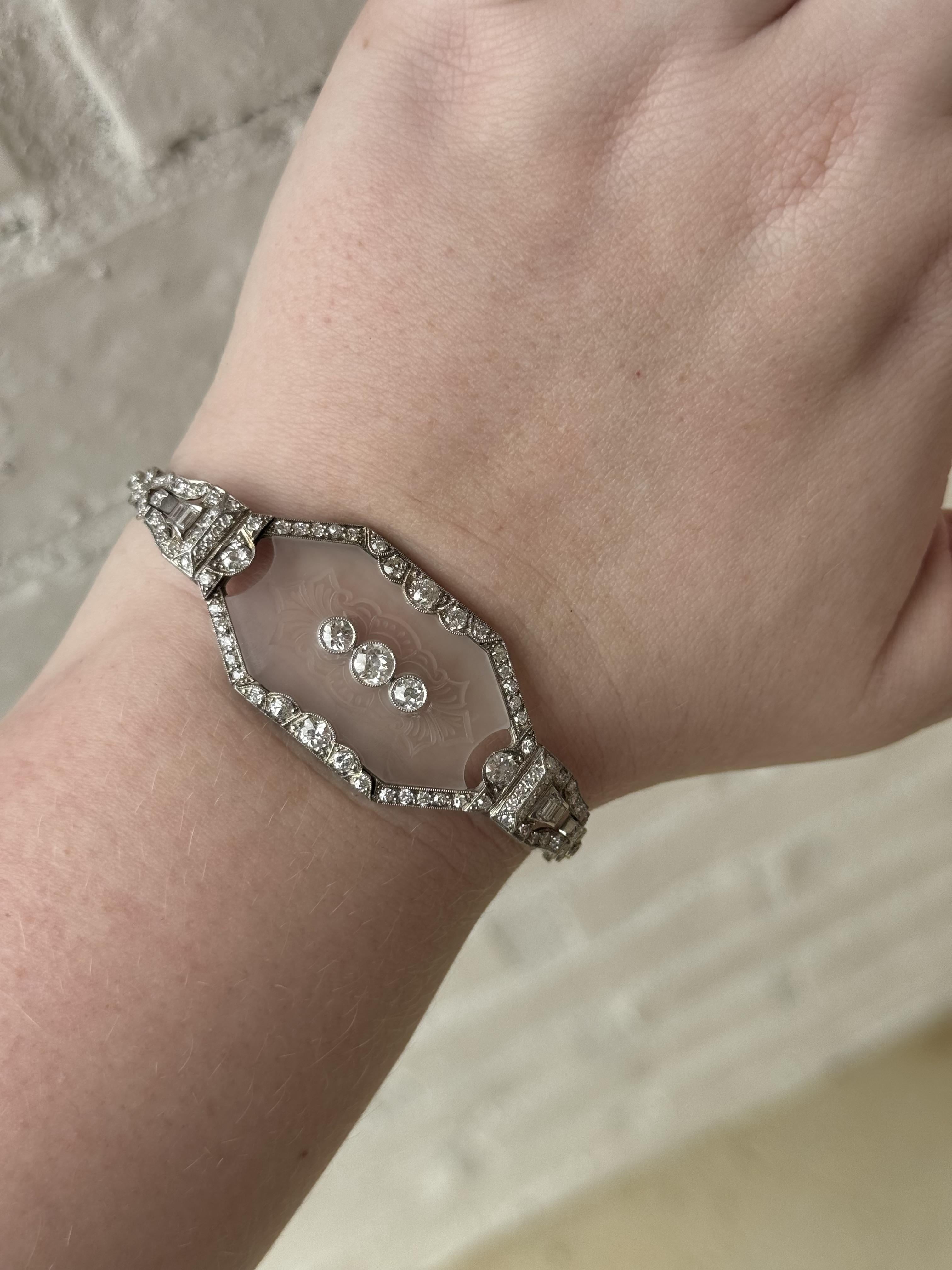 We are in awe over this vintage gem!!

Bracelet Details
Material: Platinum
Era: Art Deco 1920 - 1940
Head Width: 23mm
Bracelet Width: 3mm
Weight: 21.1 Grams
Length: 8 Inch; Fits like 7.5 Inches
Bracelet Can Be Shortened

Accented by the following