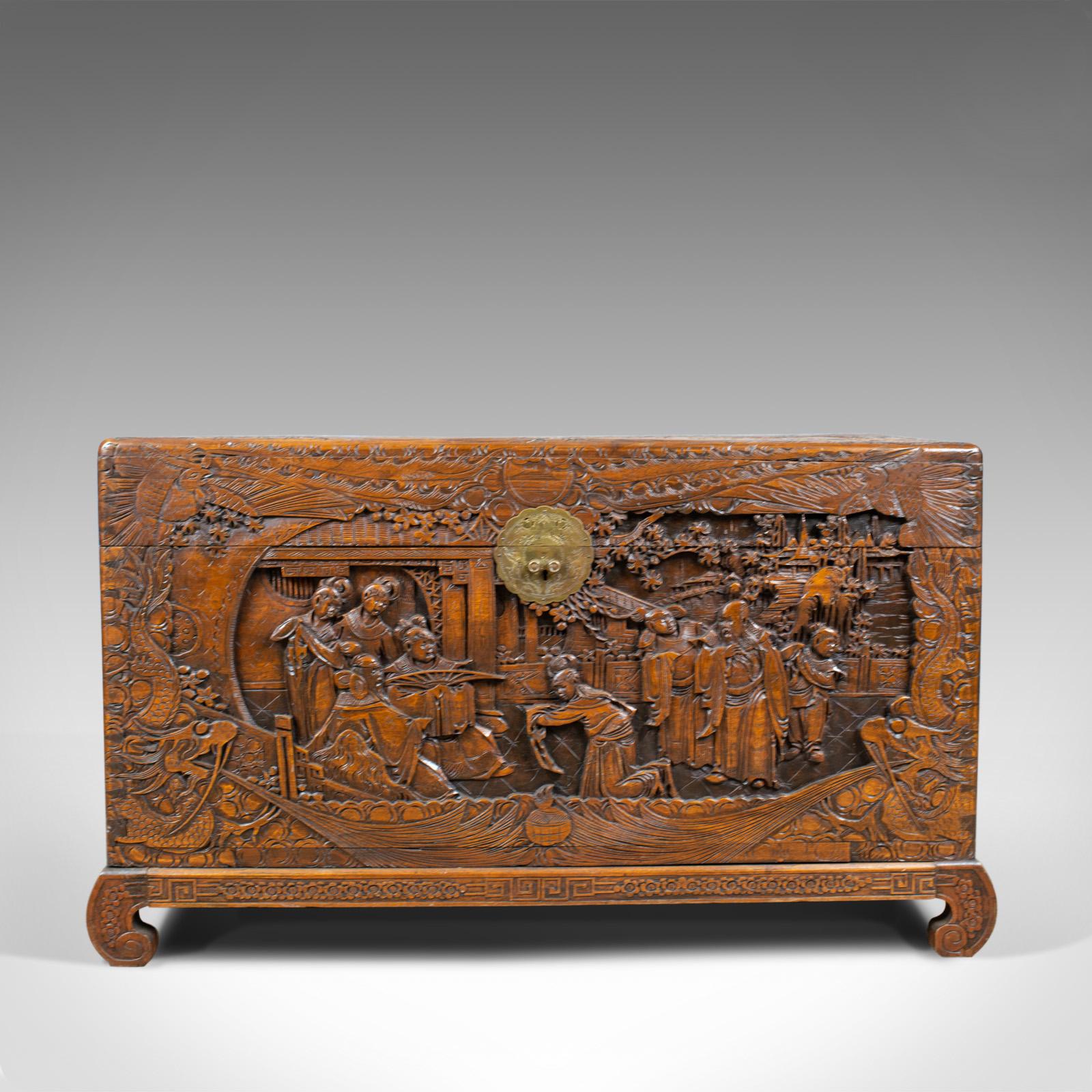 This is a vintage camphor wood chest with oriental carved scenes. A trunk dating to the early 20th century, circa 1930.

Beautifully decorated with profusely carved panels
Detail and interest to every inch of the chest
Standing upon shaped,
