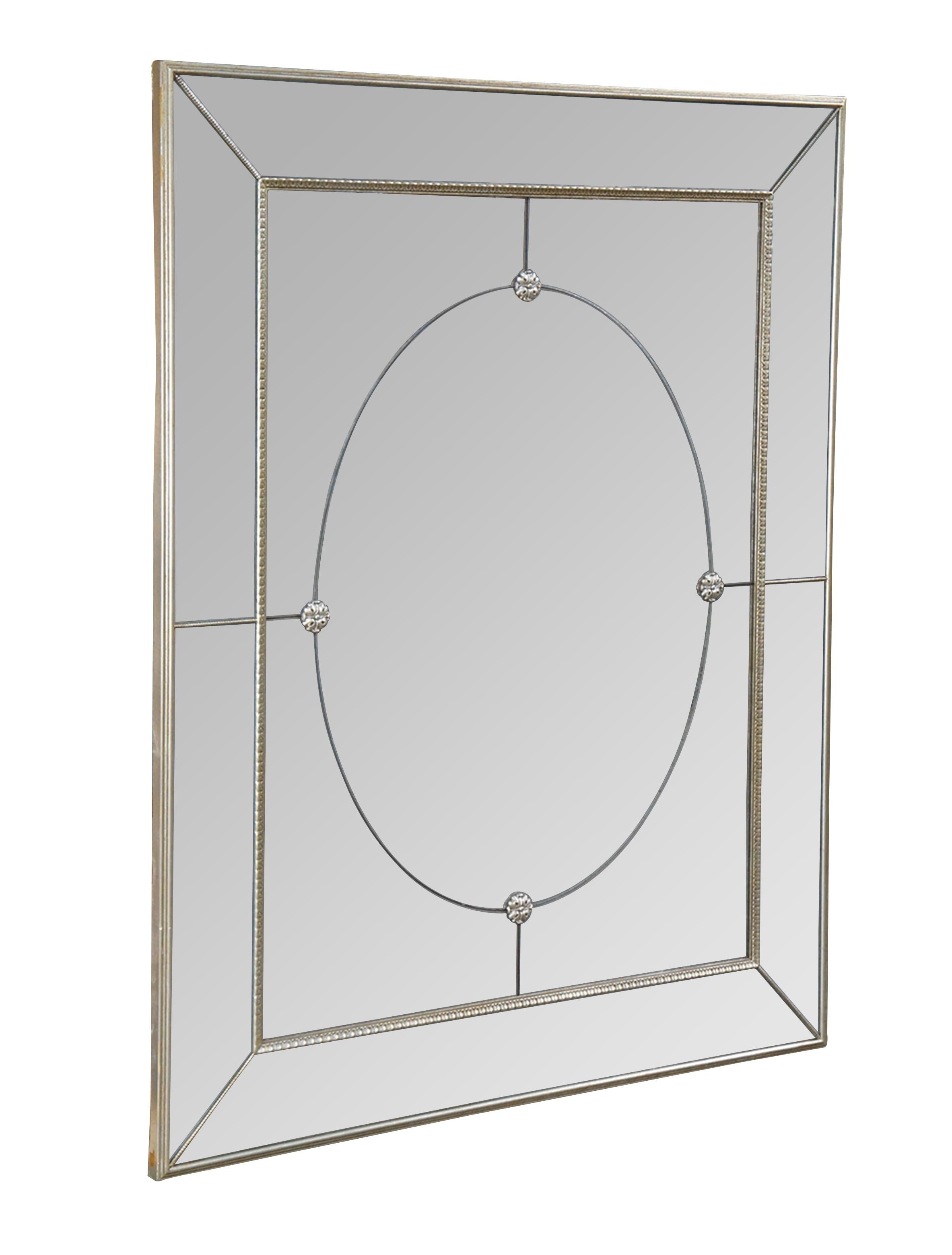 Vintage wall, hall, vanity or overmantel mirror featuring Venetian styling with antiqued hazy glass and silver medallion accents.  Made in Canada.

Dimensions:
47