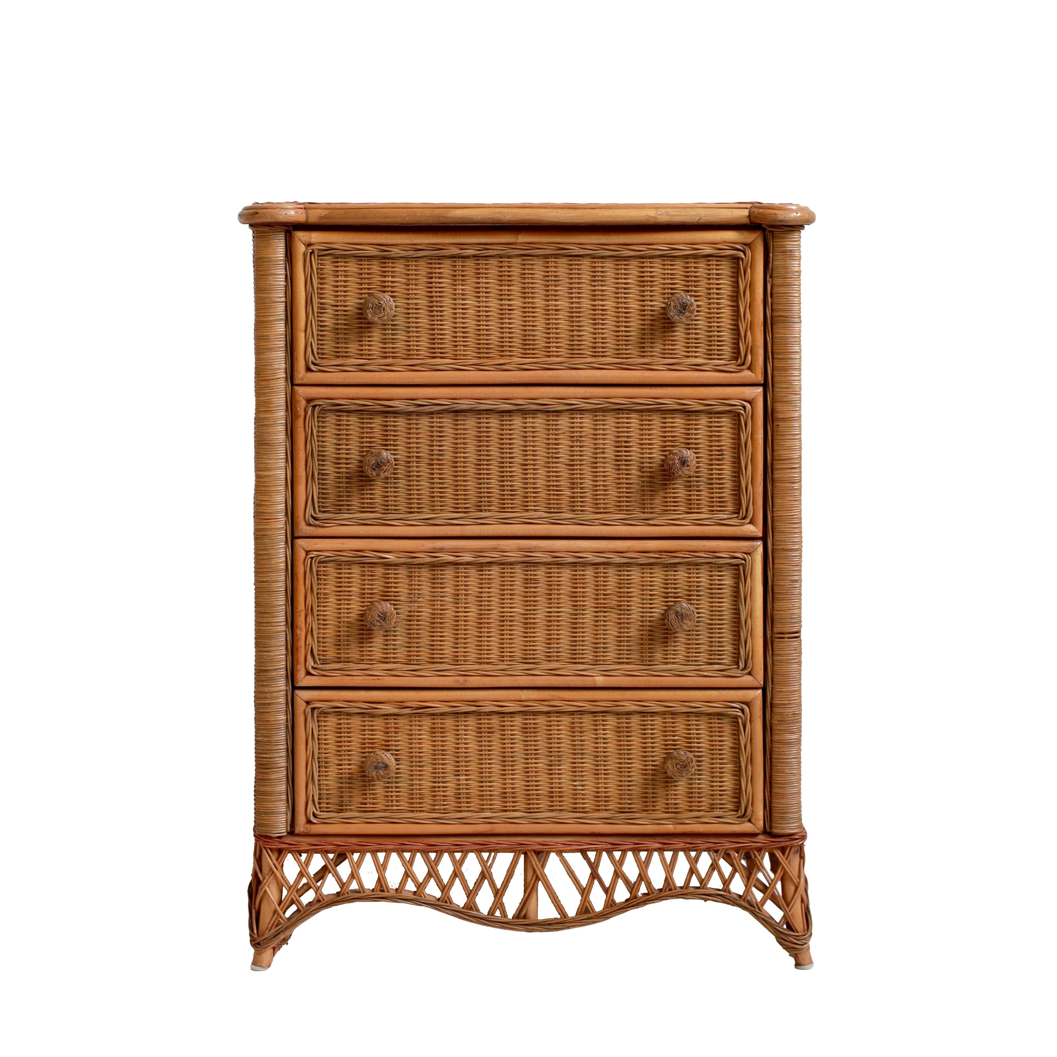 A charming vintage chest of drawers crafted from tightly woven cane and bamboo, featuring four spacious drawers, each adorned with matching cane-wrapped knobs. The natural honey-toned finish enhances its warm, organic aesthetic. Crafted with great