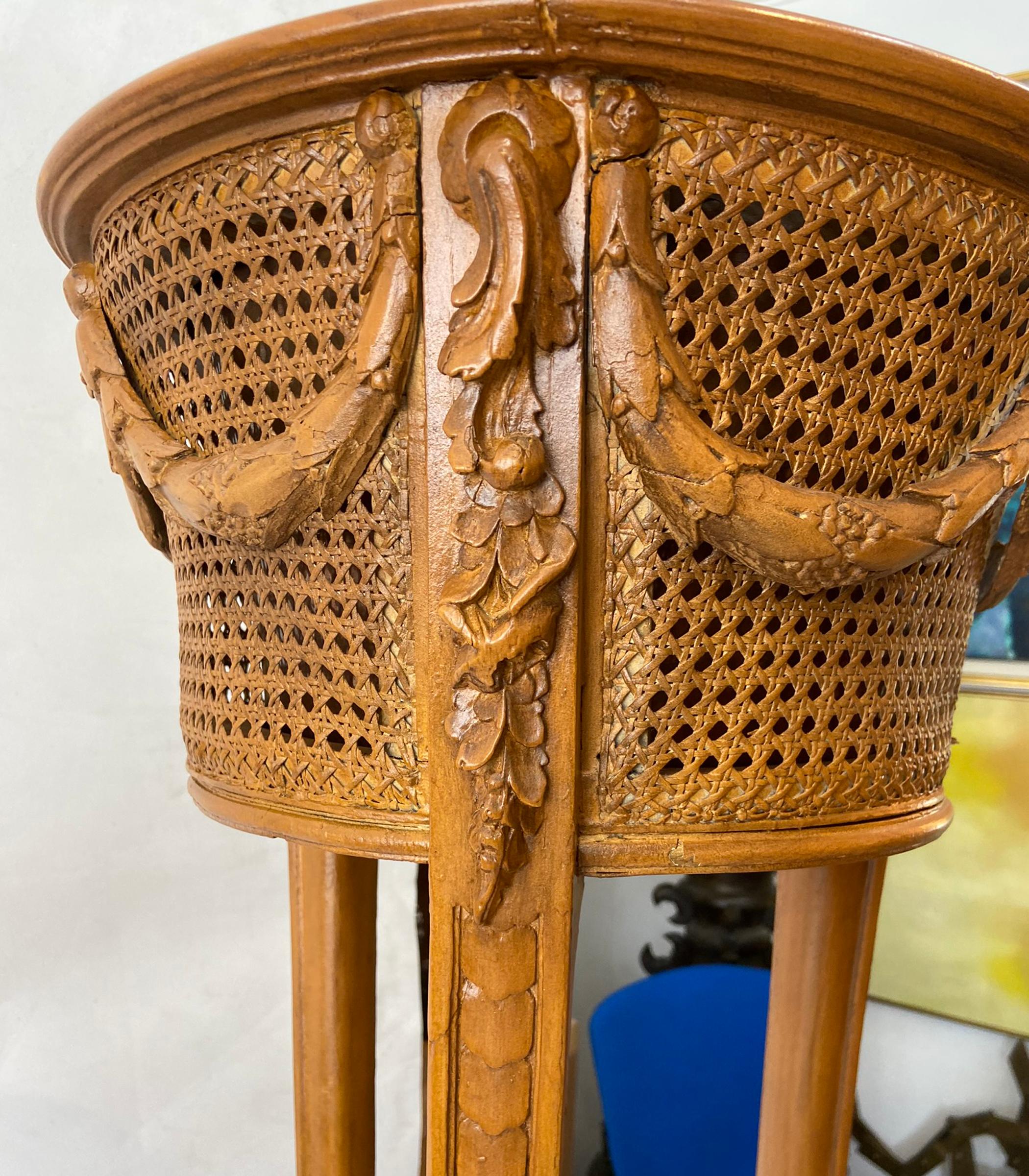Vintage plant stand. Three carved wood legs supporting metal lined planter. Cane with draped decoration. In very good condition no damage to cane.