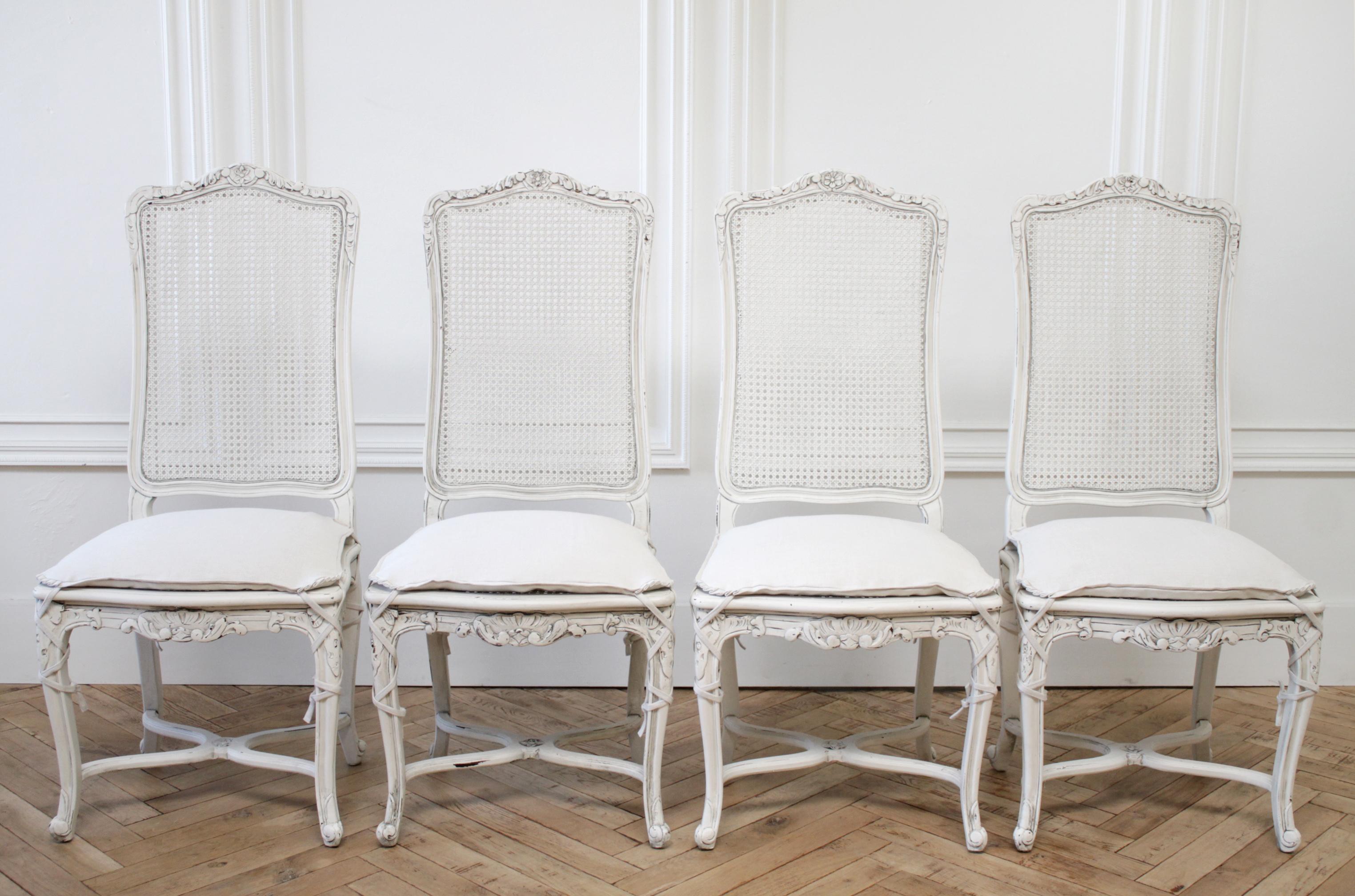 Vintage cane back Louis XV style dining chairs with linen slip covered cushions
Solid and sturdy, ready for everyday use. These set of 4 cane back chairs have been painted in a soft oyster white, with subtle distressed edges, and finished with an