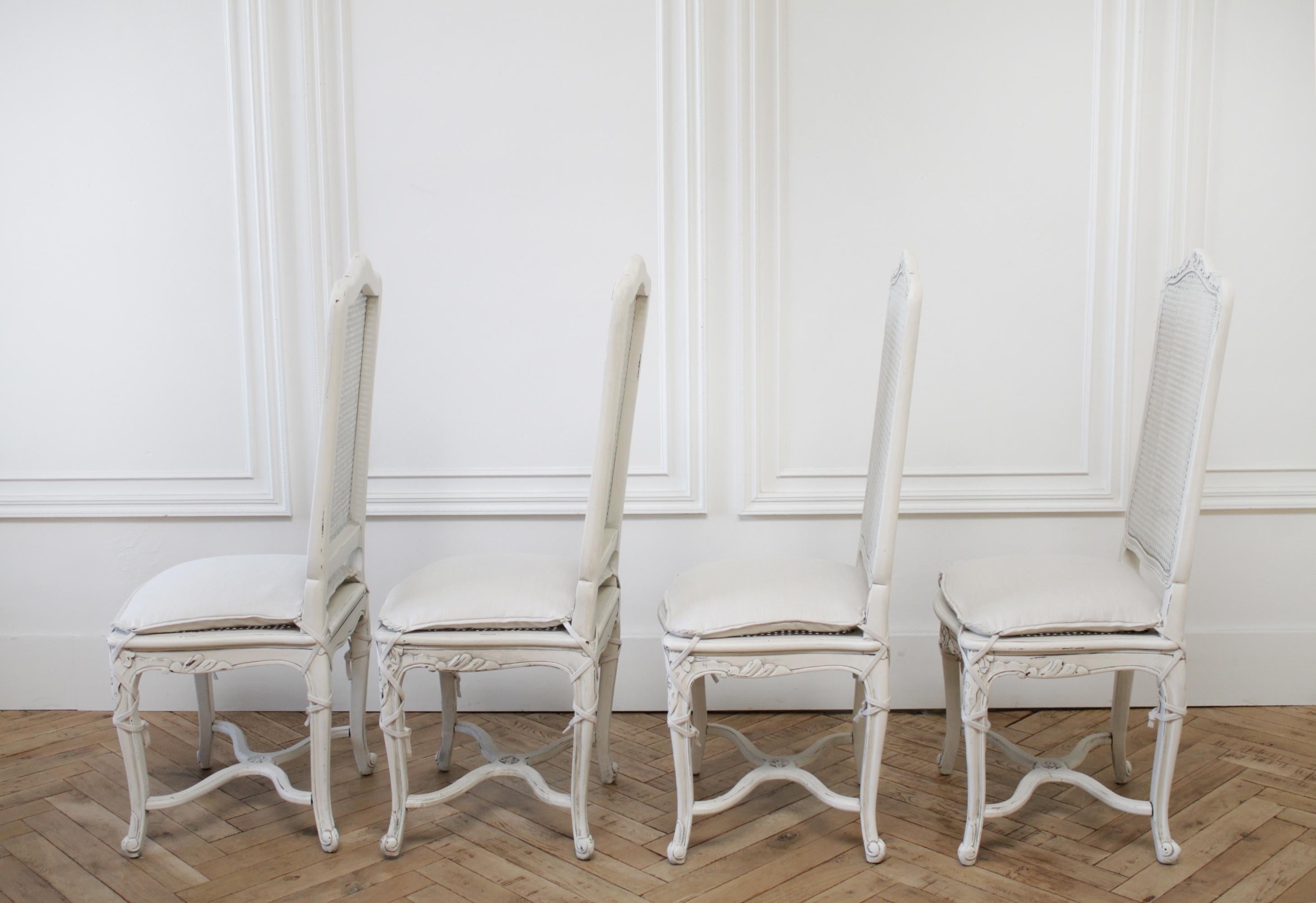 white cane dining chairs