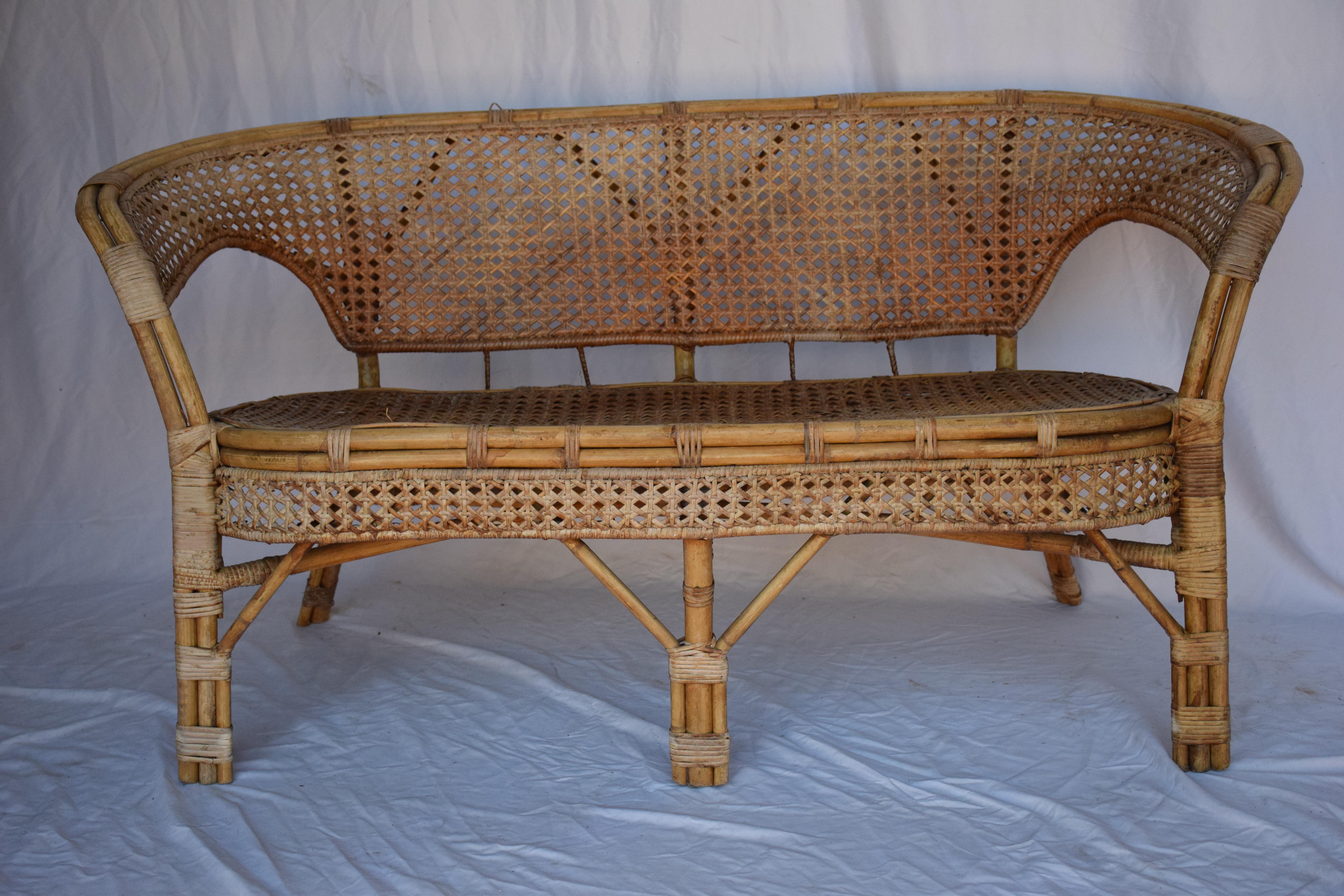 This Vintage French Cane and Bamboo settee is at home on an indoor porch, as an accent piece in a living space. Add a couple of accent pillows to complete the look. Easily moved from one area of your home to another.
