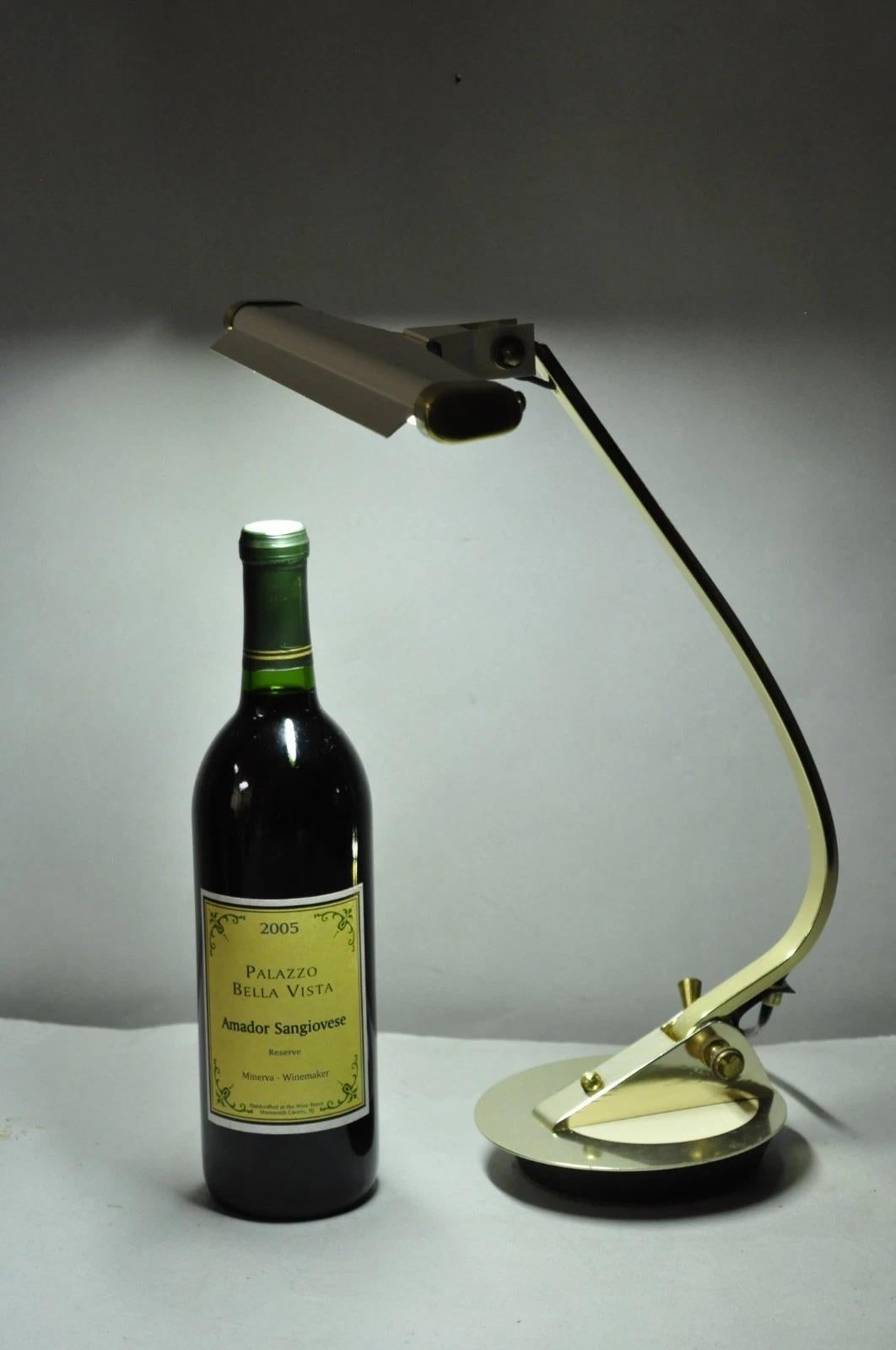 Vintage Mid Century Modern White Enamel & Brass Space Age Adjustable Desk Lamp by Cannon Products Inc. Circa Late 20th Century. Measurements: 14
