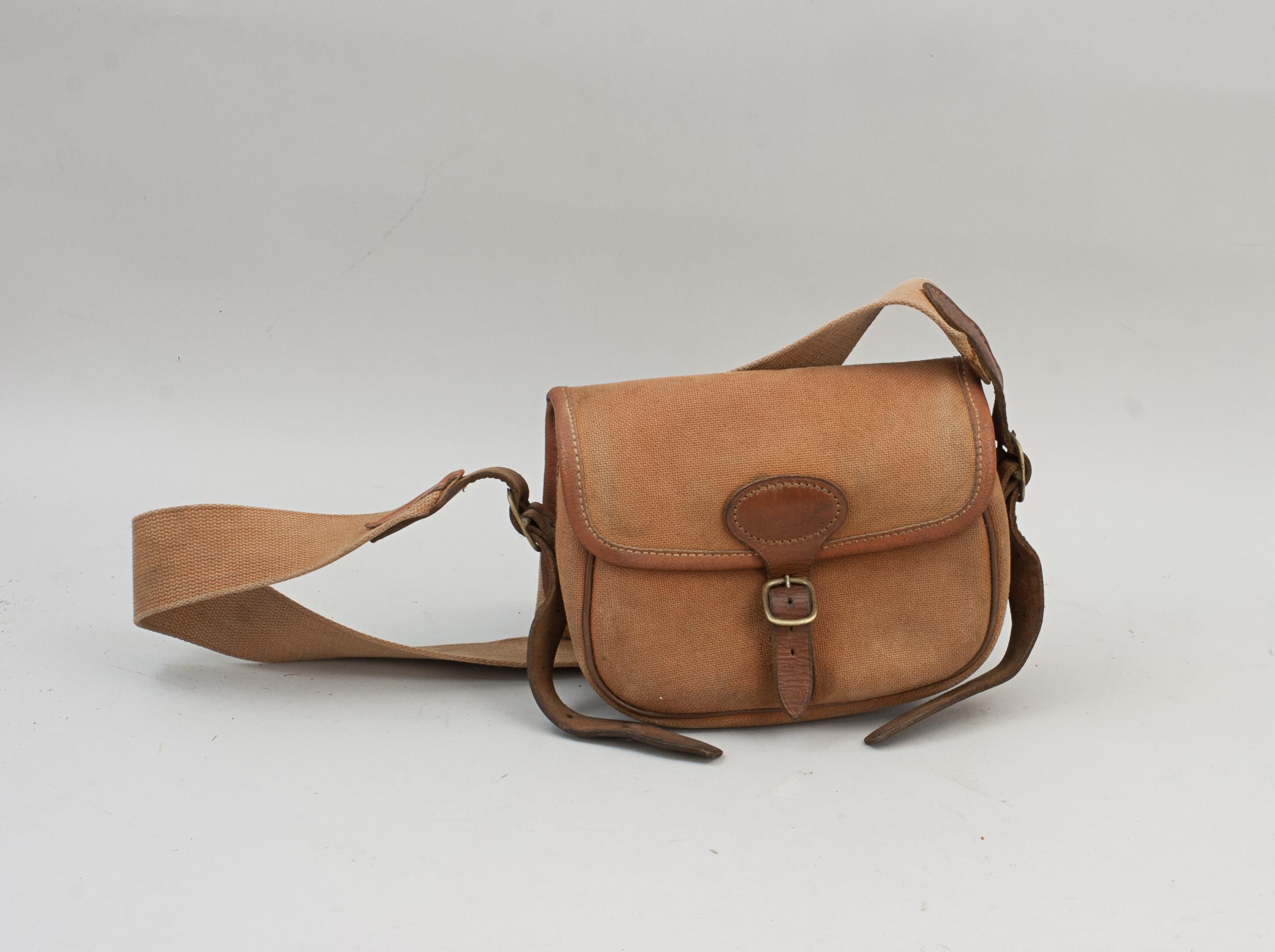 Vintage canvas brady cartridge bag.
A good quality small 'Brady' canvas cartridge bag by Brady, Halesowen. The bag is in good usable condition with brass fittings, leather trim and a cotton web adjustable shoulder strap. The bag has the cloth Brady