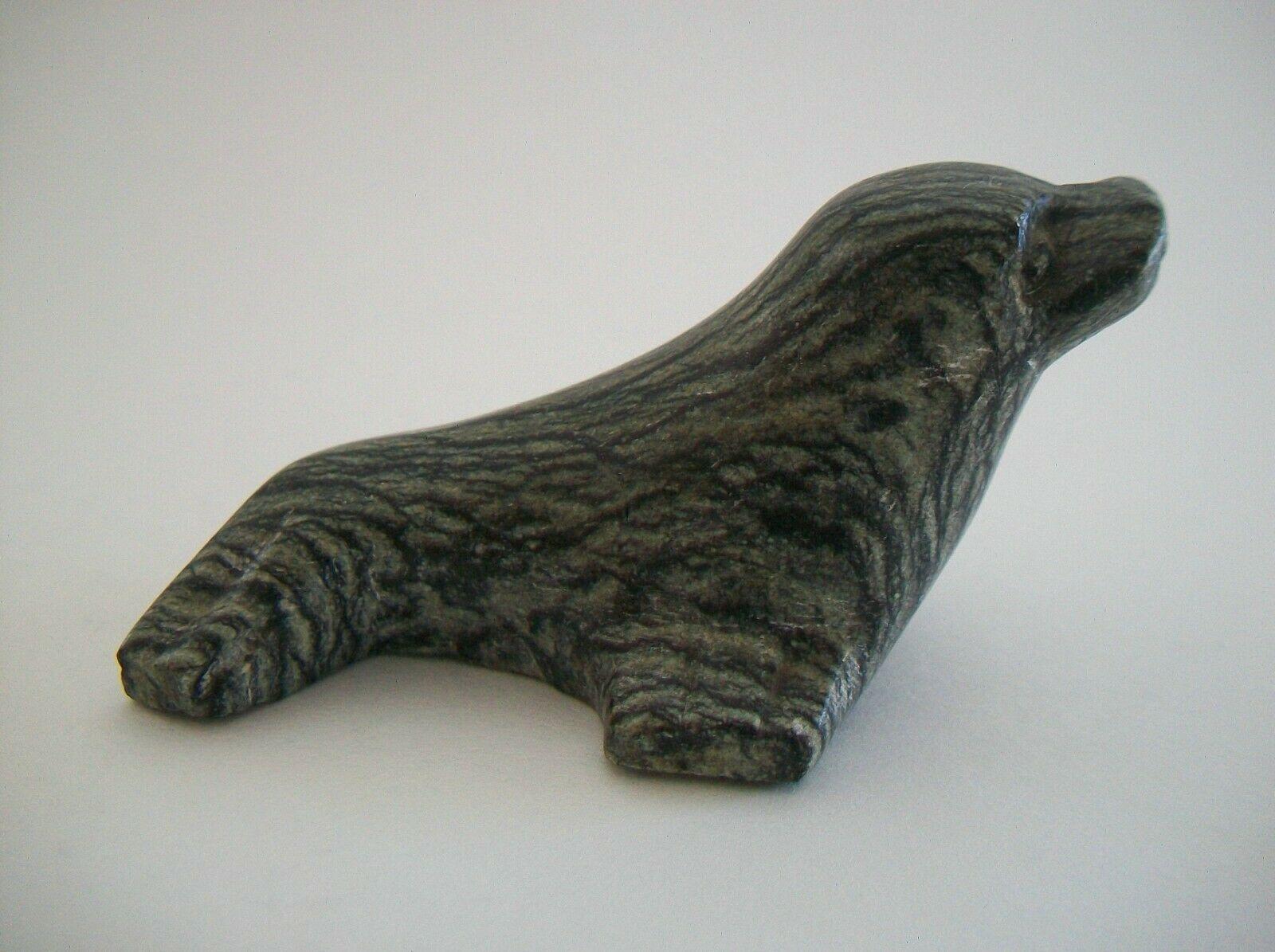 Vintage Cape Dorset Inuit soapstone (also called Steatite) carving of a seal - featuring fine simplified carving and details accentuating the form of the animal - unsigned - Canada - circa 1960's.

Excellent vintage condition - minor scuffs and