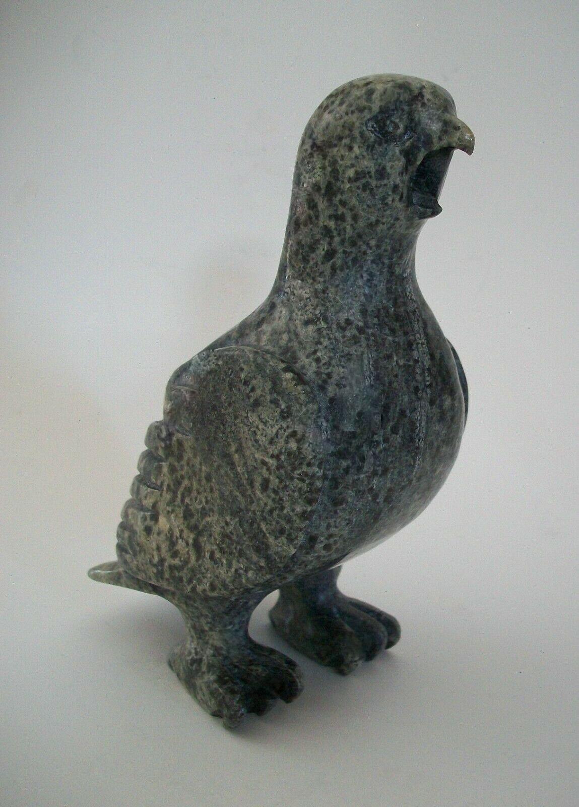 Vintage Cape Dorset Inuit stone carving of a screeching Ptarmigan - fine carving with articulated feathers and feet - signed TR (in Roman - unknown / unidentified artist) on the base - Canada - circa 1960's.

Excellent vintage condition - minor