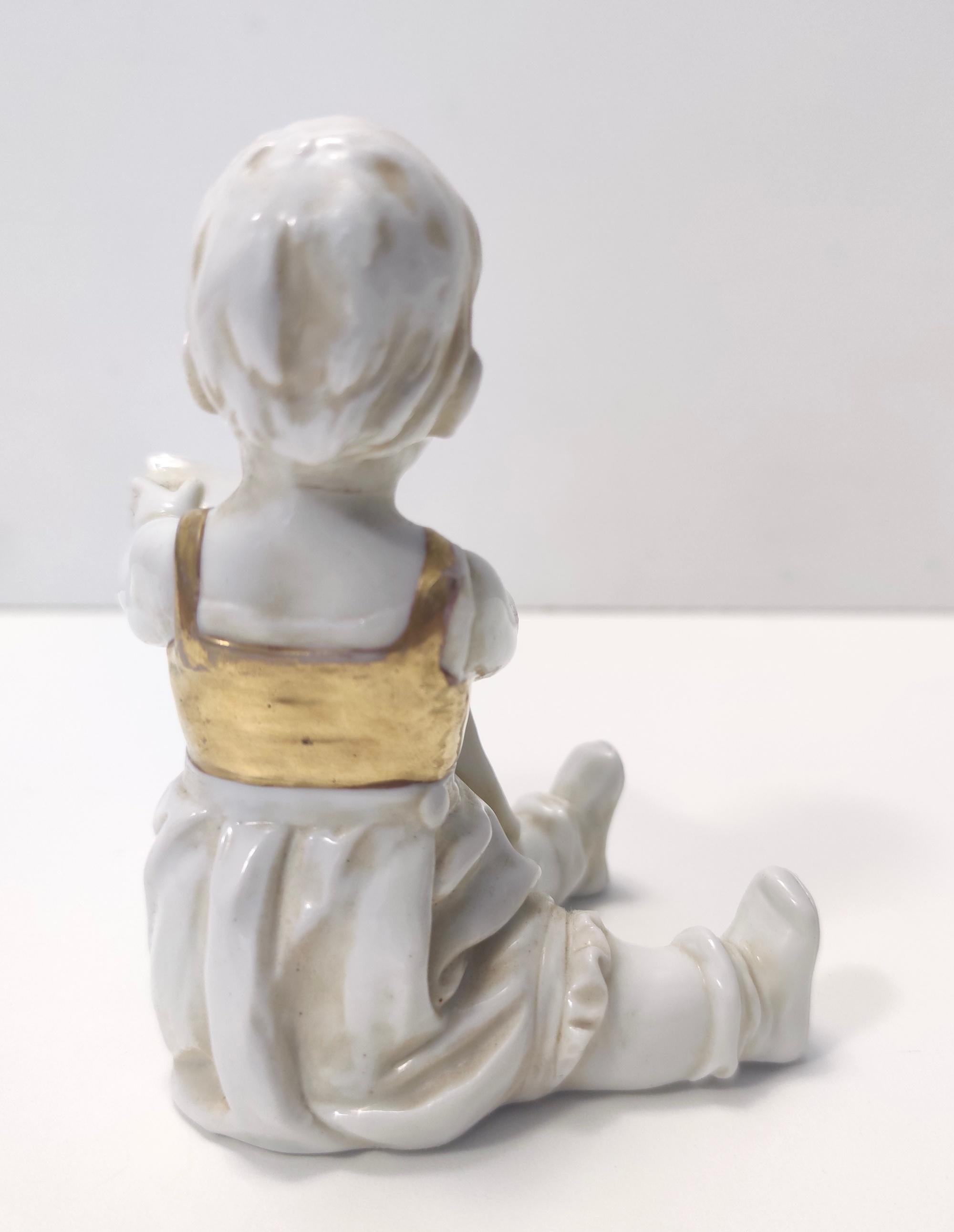 Lacquered Vintage Capodimonte Ceramic and Gold Decorative Item of a Reading Child, Italy For Sale