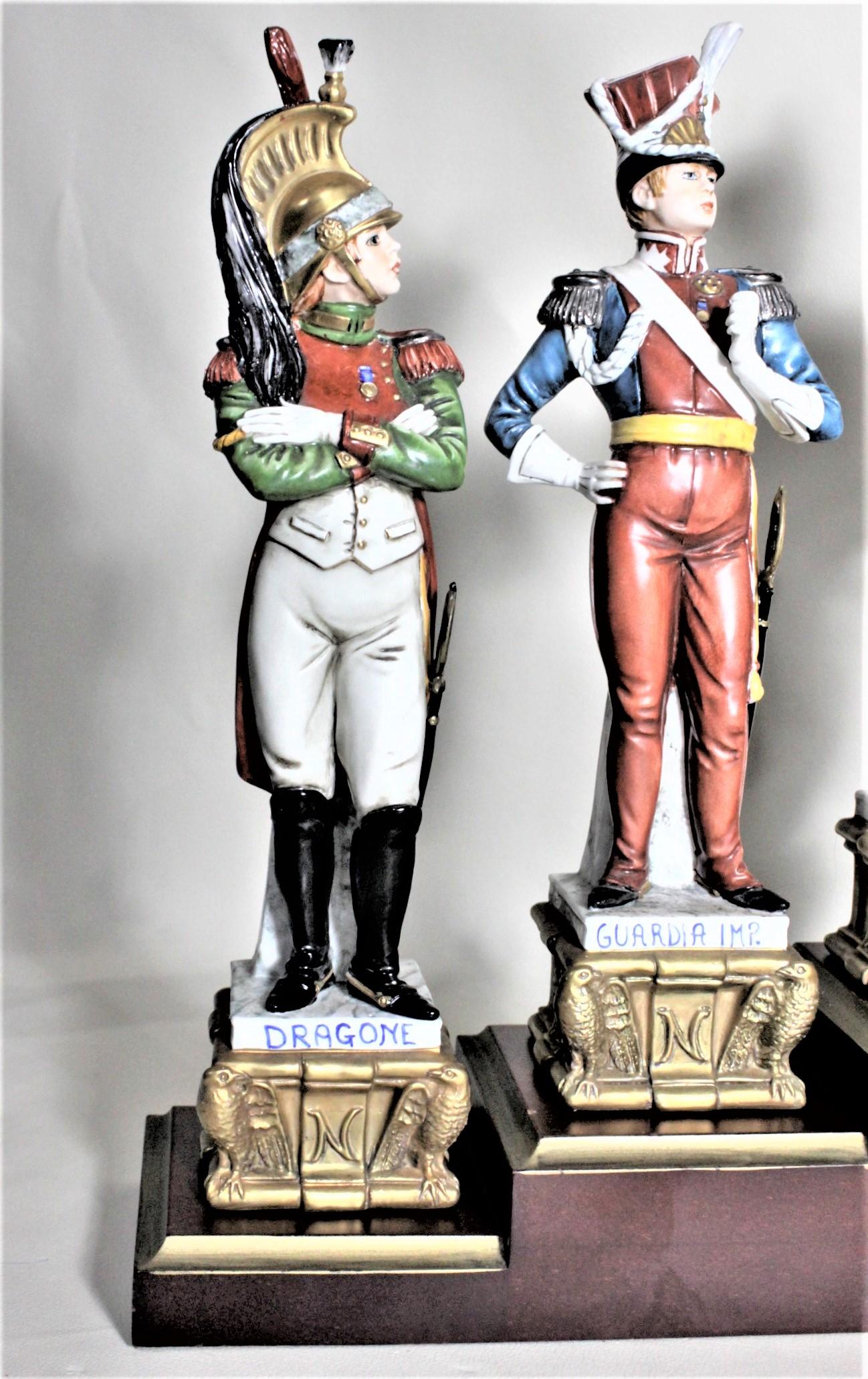 This set of eight porcelain figurines was made by the Capodimonte factor of Italy in circa 1980 in the Renaissance style. Seven of the figurines depict famous military figures and are very detailed in their hand painted finishes. We are unclear as