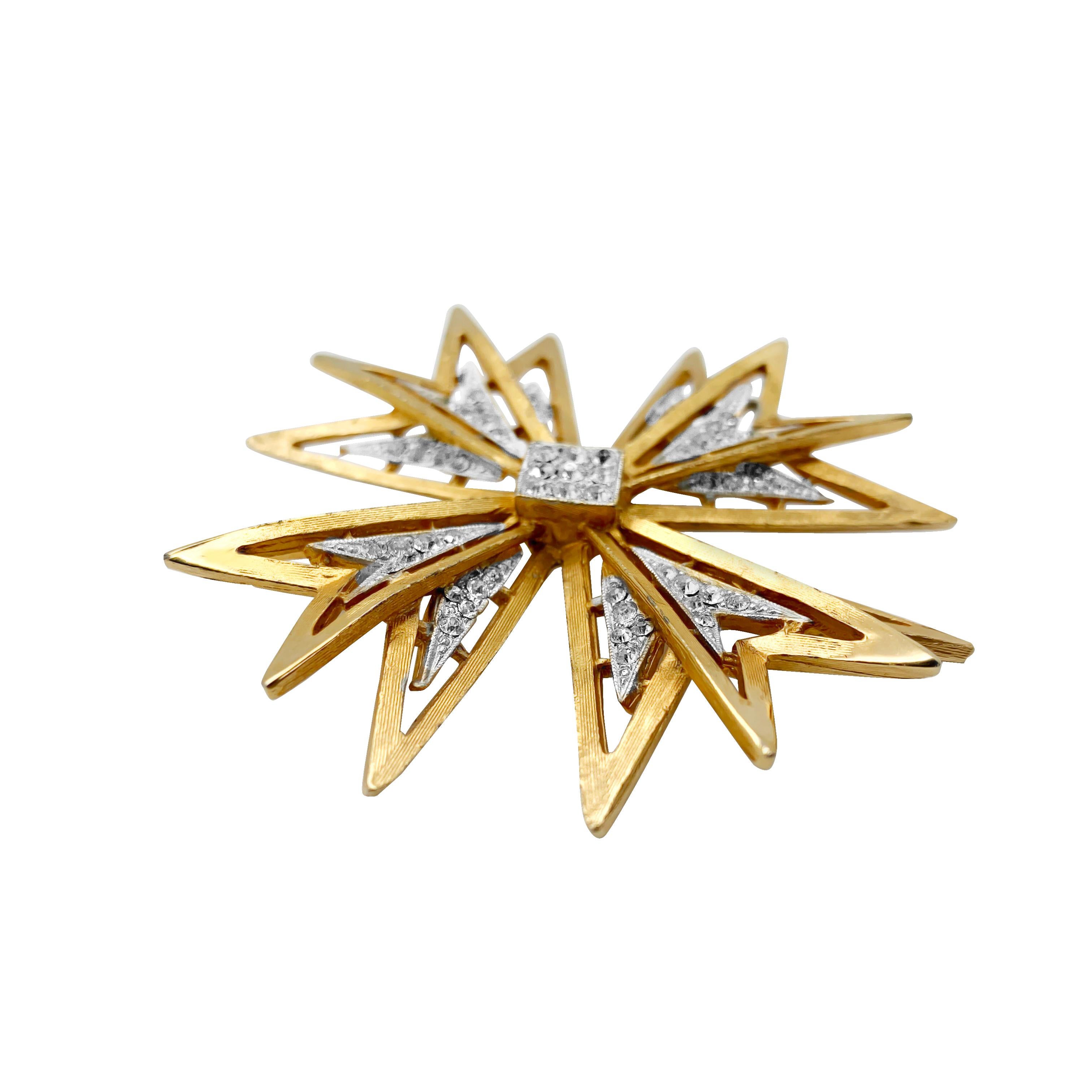 A large vintage Capri Maltese Cross brooch. Featuring a fabulously statement sculptural Maltese cross in brushed metal set with crystal accents. 
Vintage Condition: Very good without damage or noteworthy wear. 
Materials: gold plated metal, glass