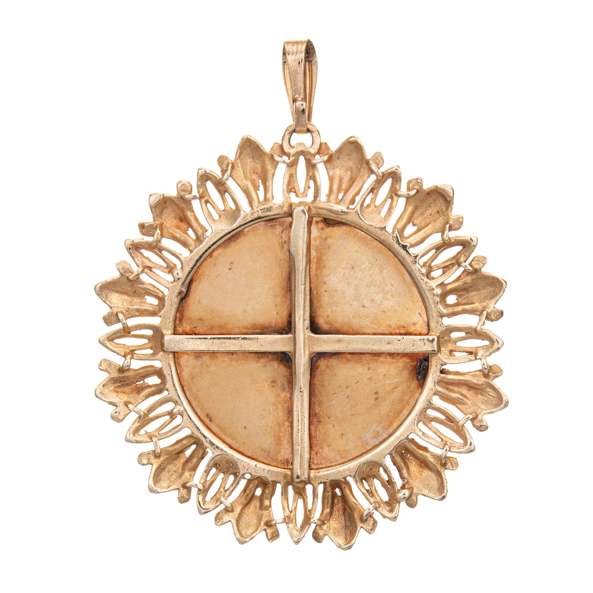 Finely detailed large Capricorn medallion pendant crafted in 14k yellow gold (circa 1970s).   

The large medallion pendant measures 49mm diameter (1.92 inches) and features a raised Capricorn design. The elaborate and bold design is a great example